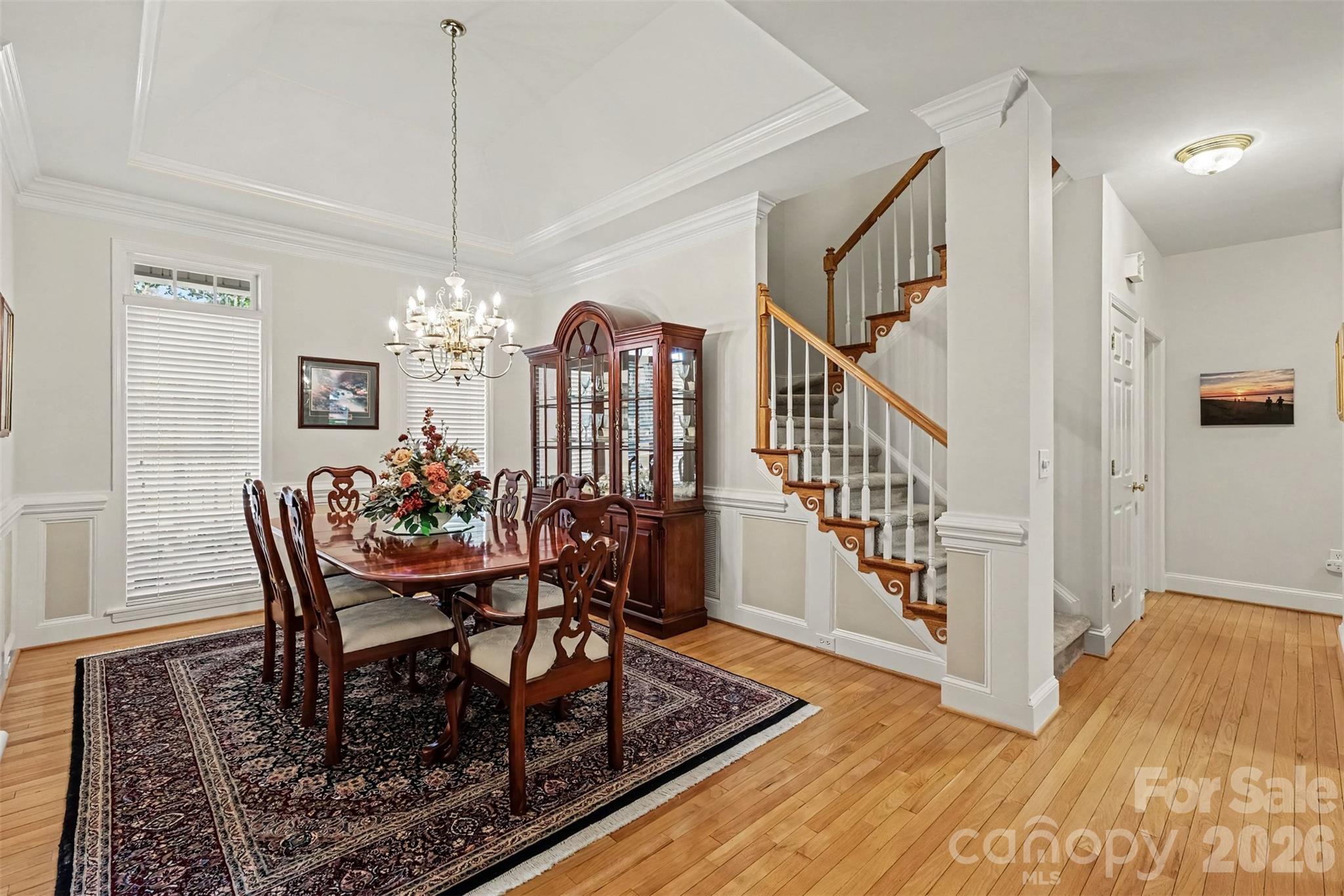 Formal Dining Room has beautiful trey ceiling, wood flooring and neutral paint. - 8412 Locksley Drive, Harrisburg