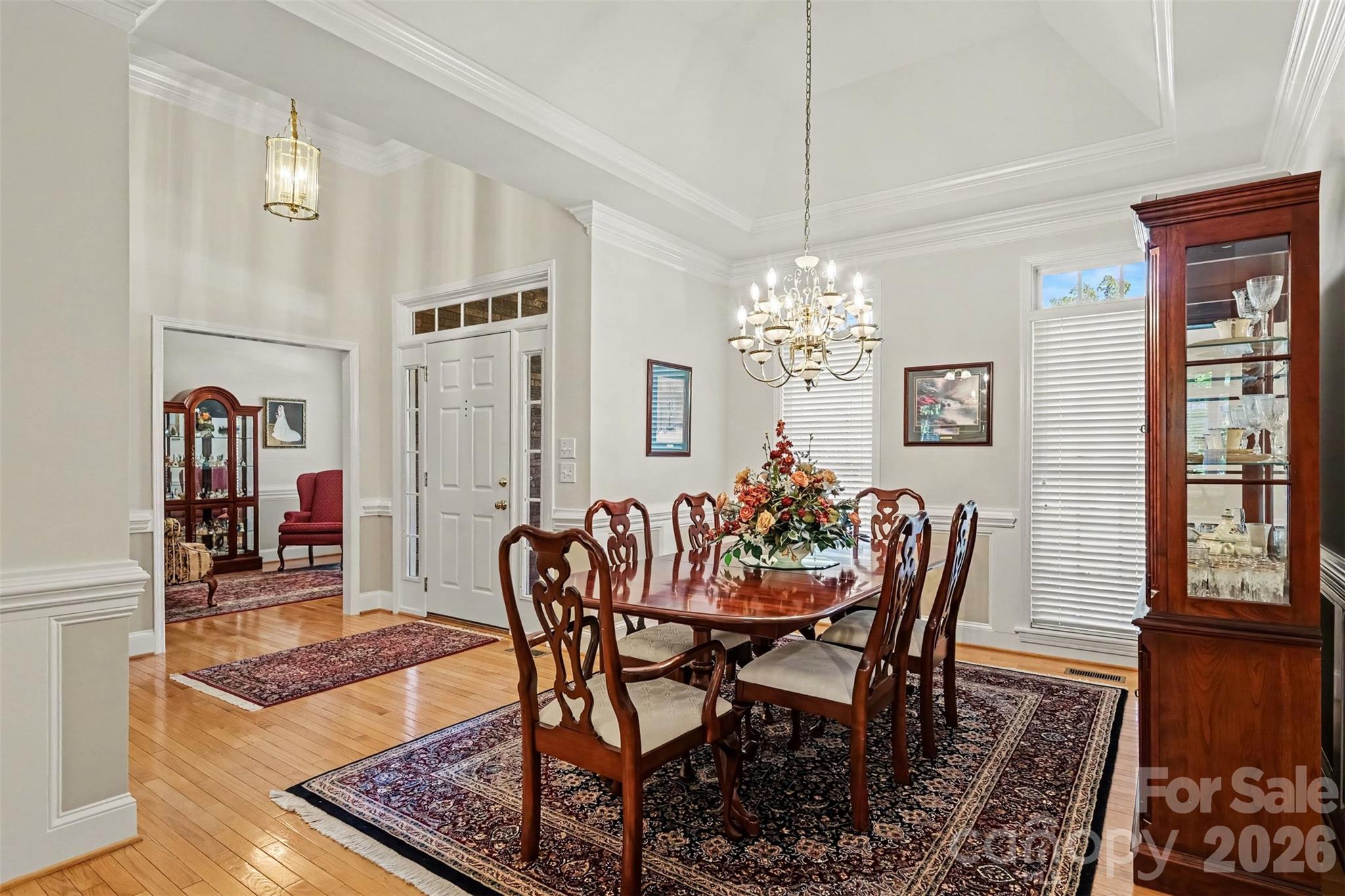 Dining Room view into the Foyer and Study off Foyer. Neutral Paint, Transoms over Windows provides lots of natural lighting. Beautiful Wood Flooring. - 8412 Locksley Drive, Harrisburg