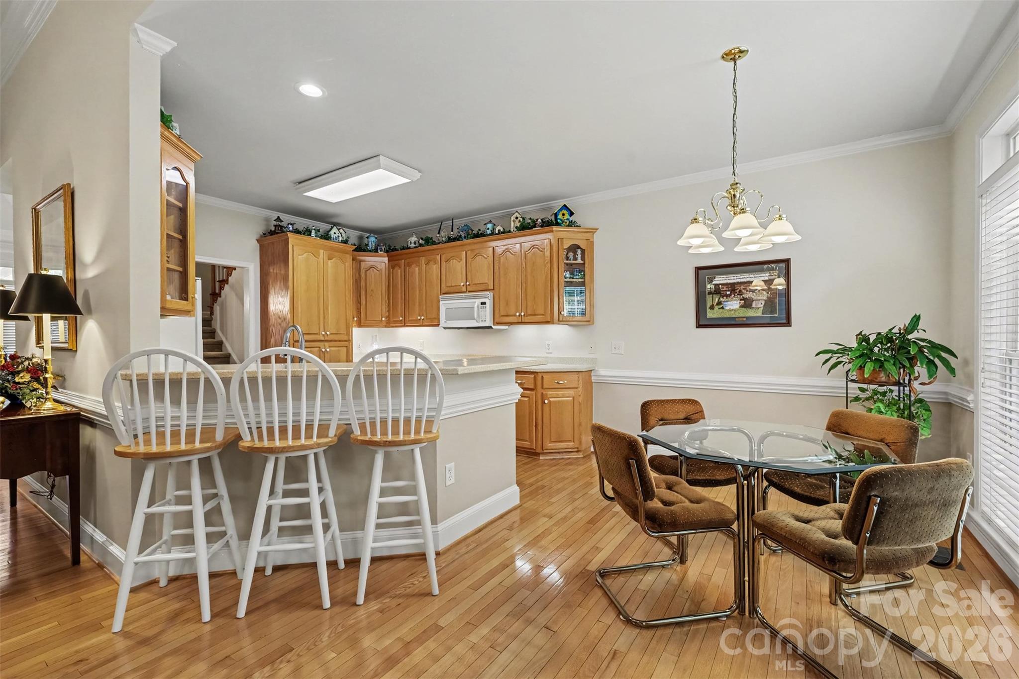 Brealfast Area with Breakfast Bar - Great for entertaiing. Beautiful Wood Flooring. Neutral Paint Throughout. Lots of natural Lighting. Open to the Great Room. - 8412 Locksley Drive, Harrisburg