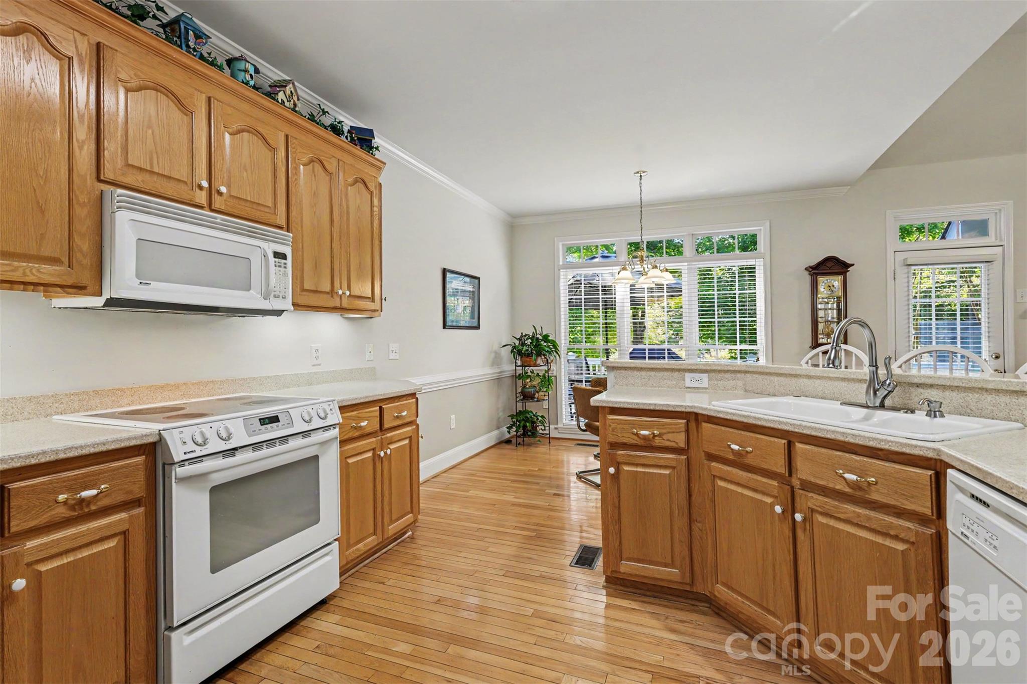 Another view of kitchen into the Breakfast Room. Again...beautiful wood flooring and neutral paint. - 8412 Locksley Drive, Harrisburg