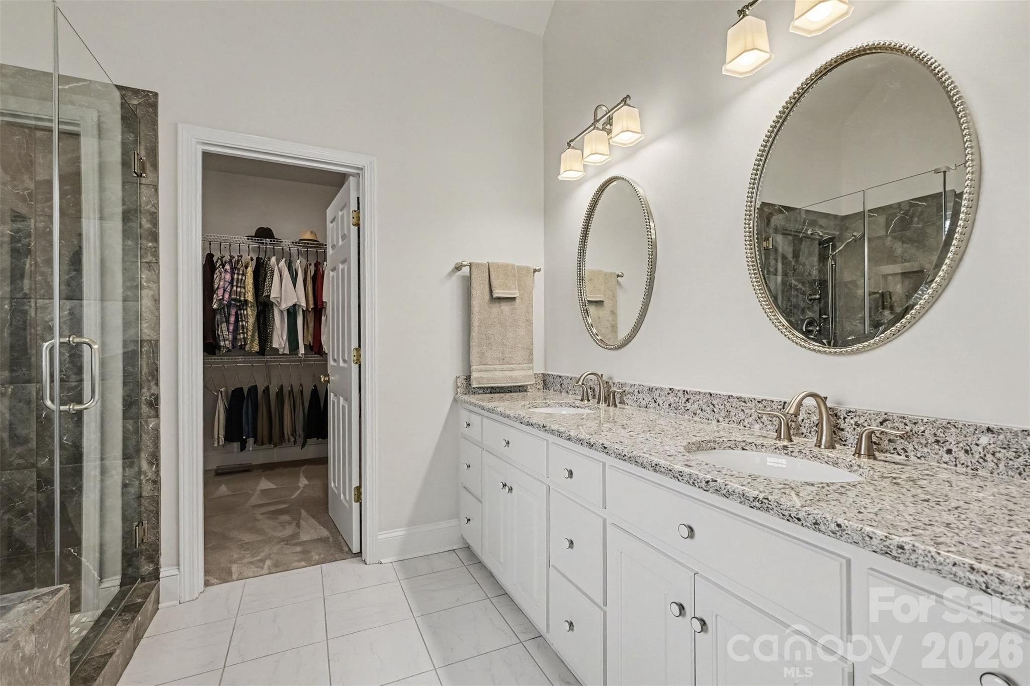 Primary Bathroom has dual sinks with extra large vanity featuring lots of counter space and drawers and storage. Neutral paint and flooring Granite Countertops. - 8412 Locksley Drive, Harrisburg