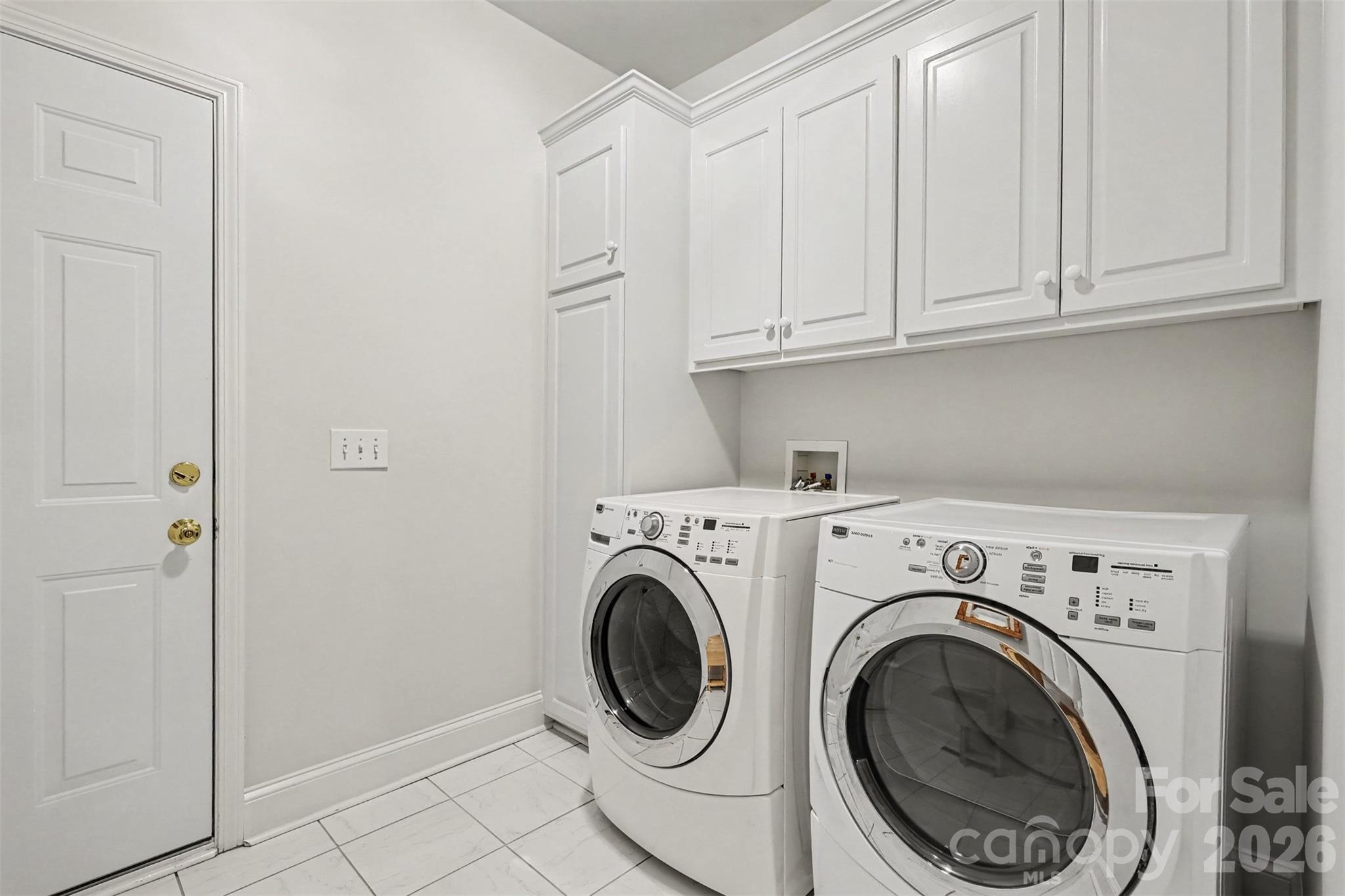 Laundry Room is located on the main level. Lots of extra storage located here. - 8412 Locksley Drive, Harrisburg