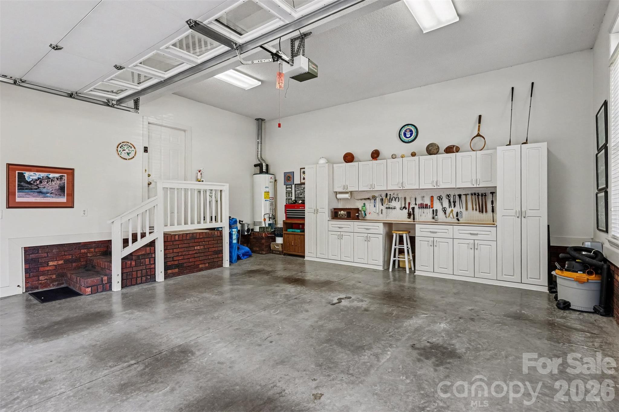 Spacous 2 Car Garage with Custom BUILT-In Cabients/Work Area. - 8412 Locksley Drive, Harrisburg