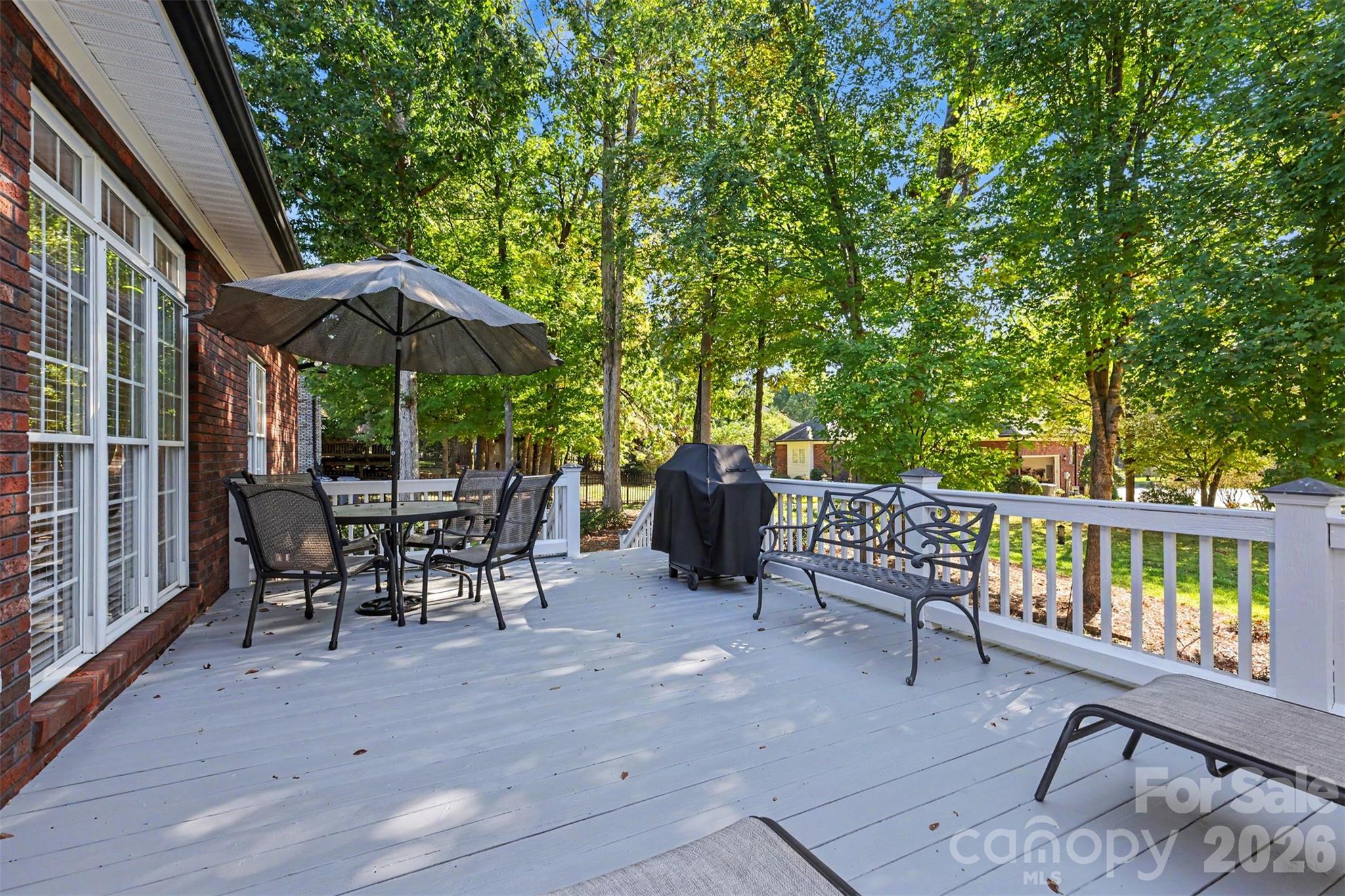 Spacious Deck located off Great Room/Breakfast Room. Canopy of trees provides a beautiful backdrop and privacy. - 8412 Locksley Drive, Harrisburg