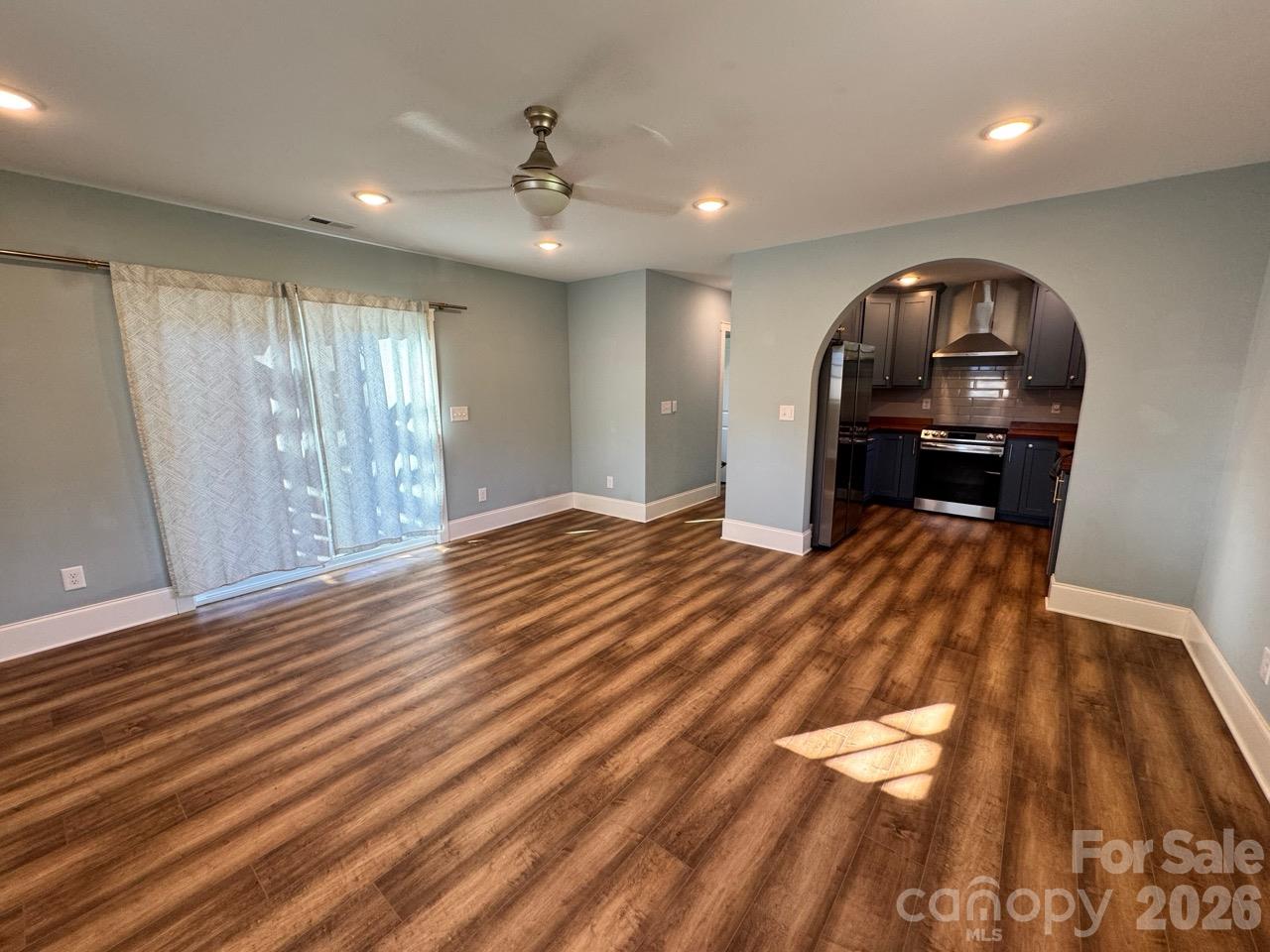 Living room view to kitchen and hall. - 52 North Lane, Brevard