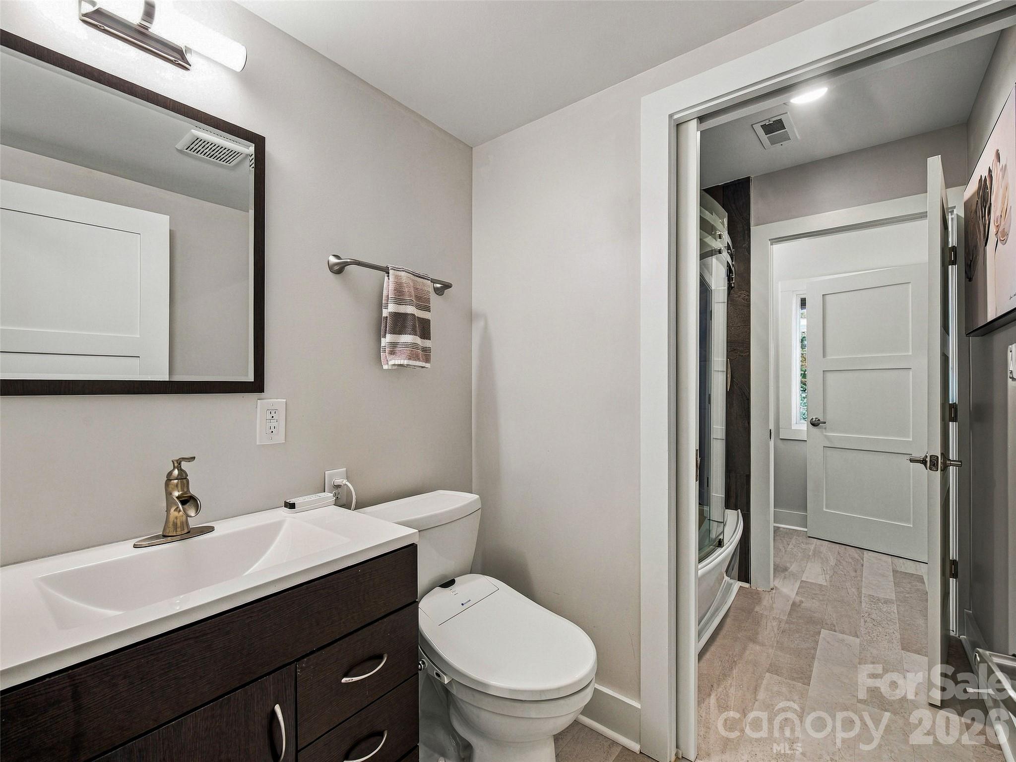 Shared bath on the lower level with two private half baths - 21 Peach Knob Drive, Asheville