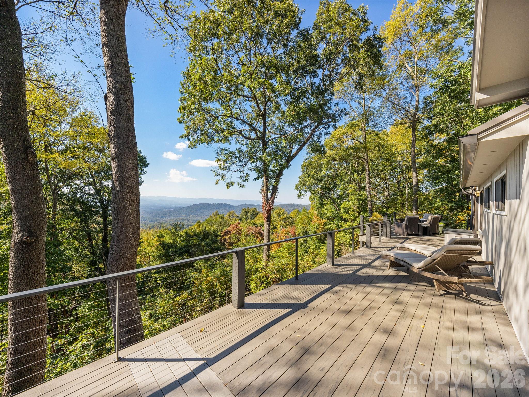Long range views from this expansive deck - 21 Peach Knob Drive, Asheville