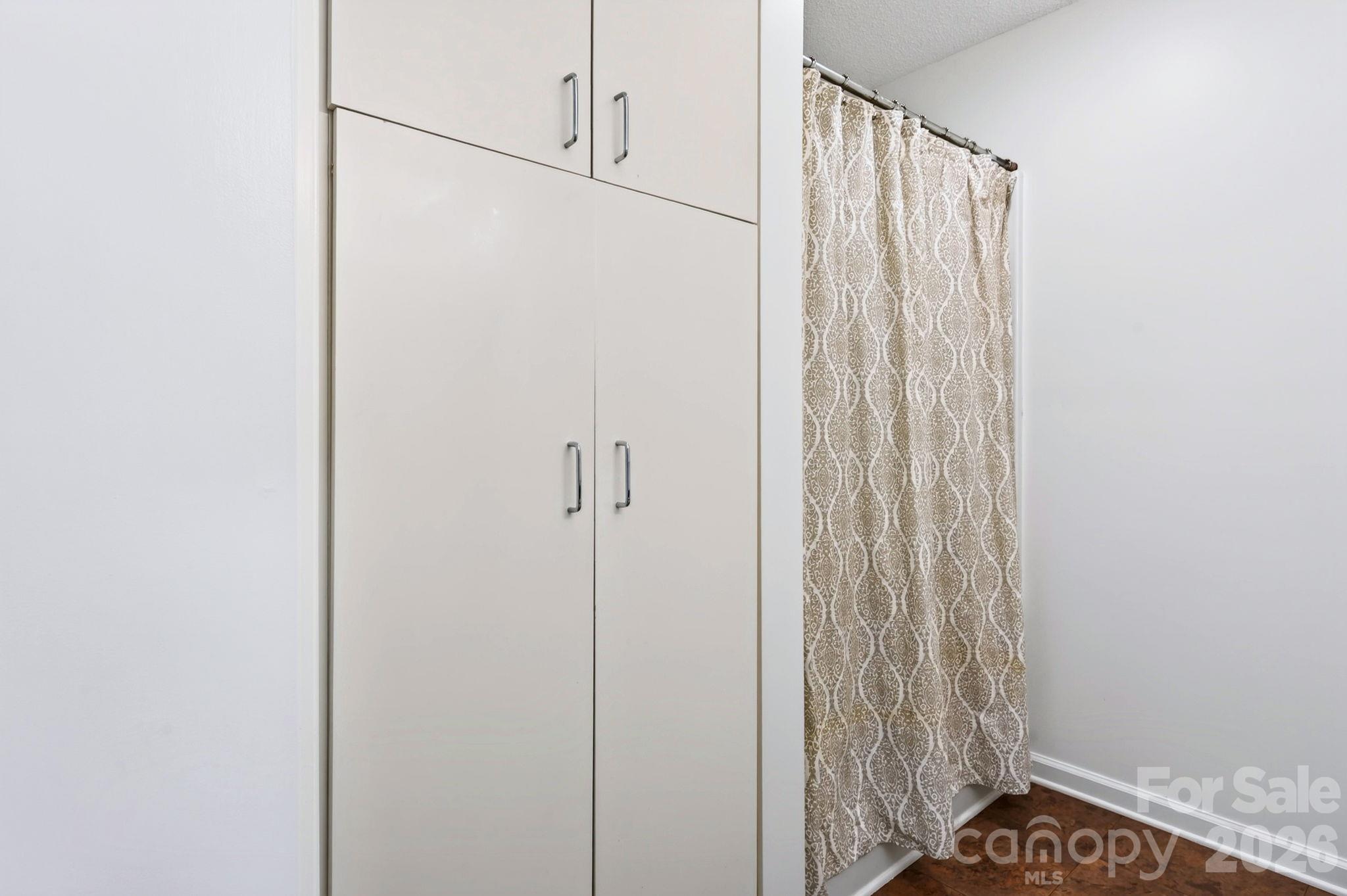 Built in linen closet in main level full bath - 43 Vermont Court, Asheville