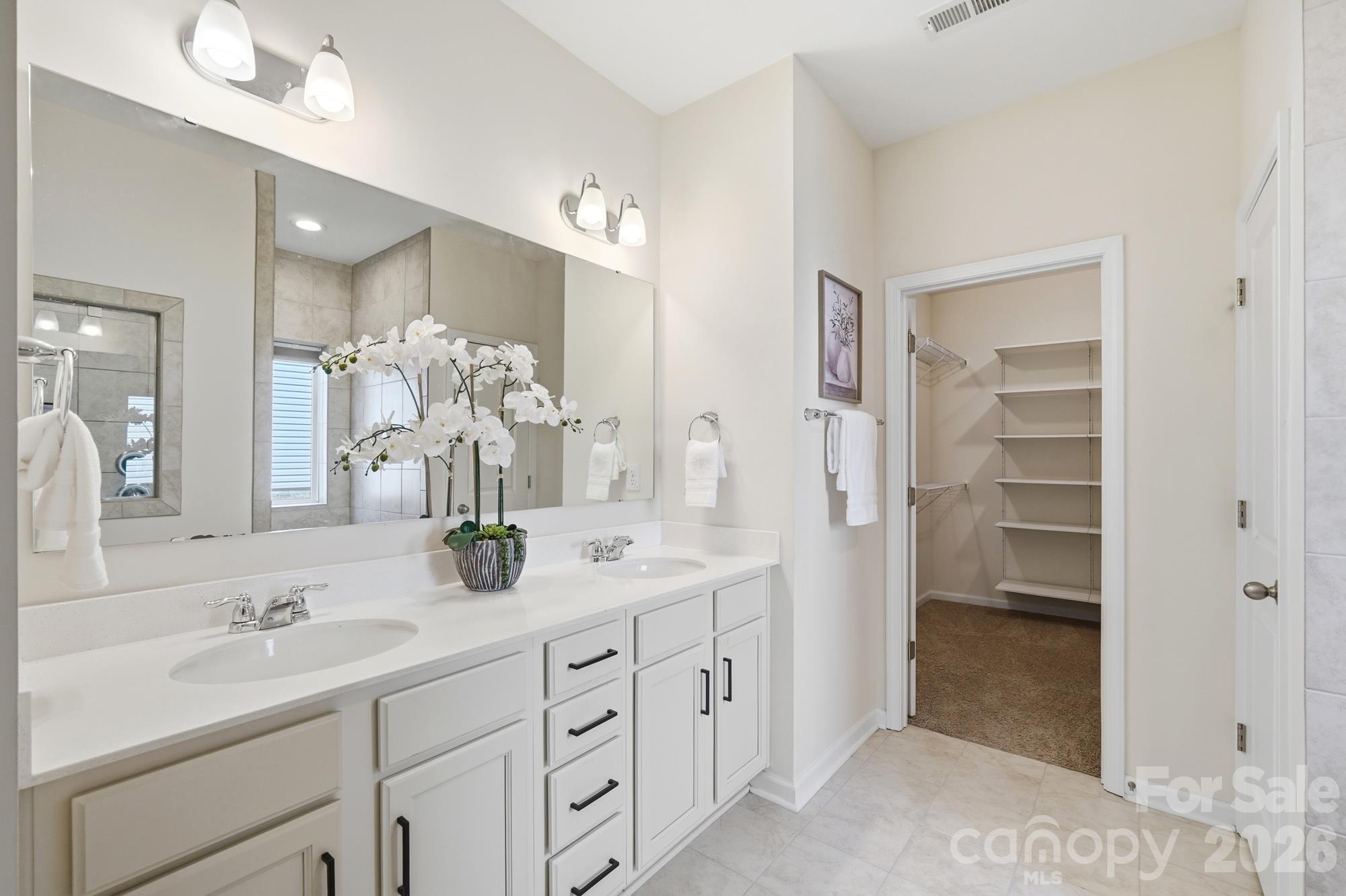 Primary Bathroom with dual vanity - 7656 Tanglewood Way, Denver
