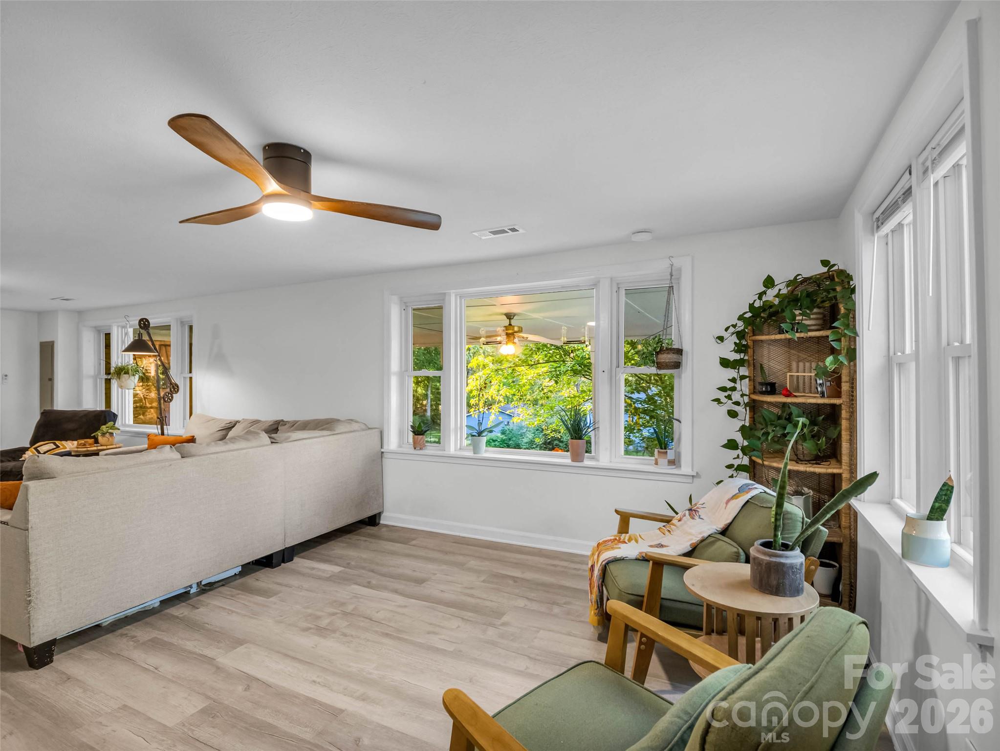Natural light fills the living space, creating a warm, inviting atmosphere. - 913 Dorothy Street, Hendersonville