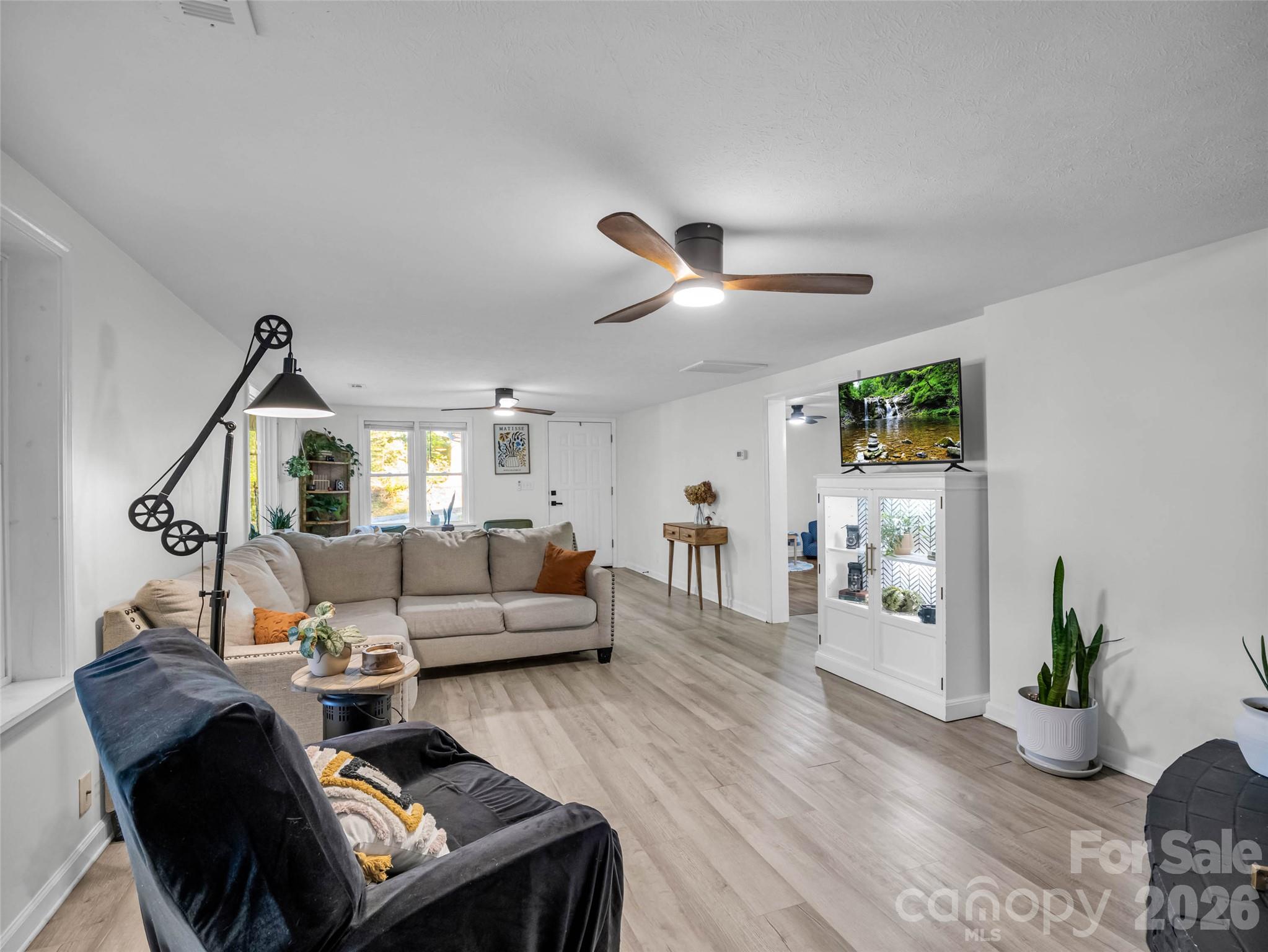 An easy-flowing layout makes the living spaces feel connected. - 913 Dorothy Street, Hendersonville