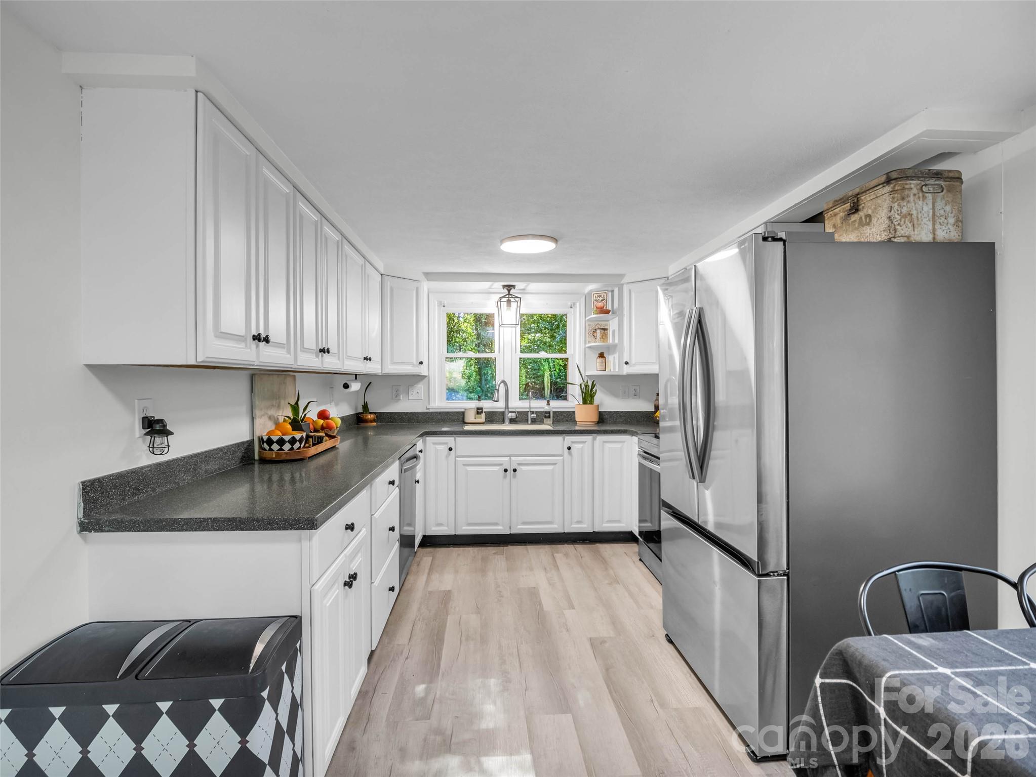 A bright, functional kitchen with ample cabinetry. - 913 Dorothy Street, Hendersonville