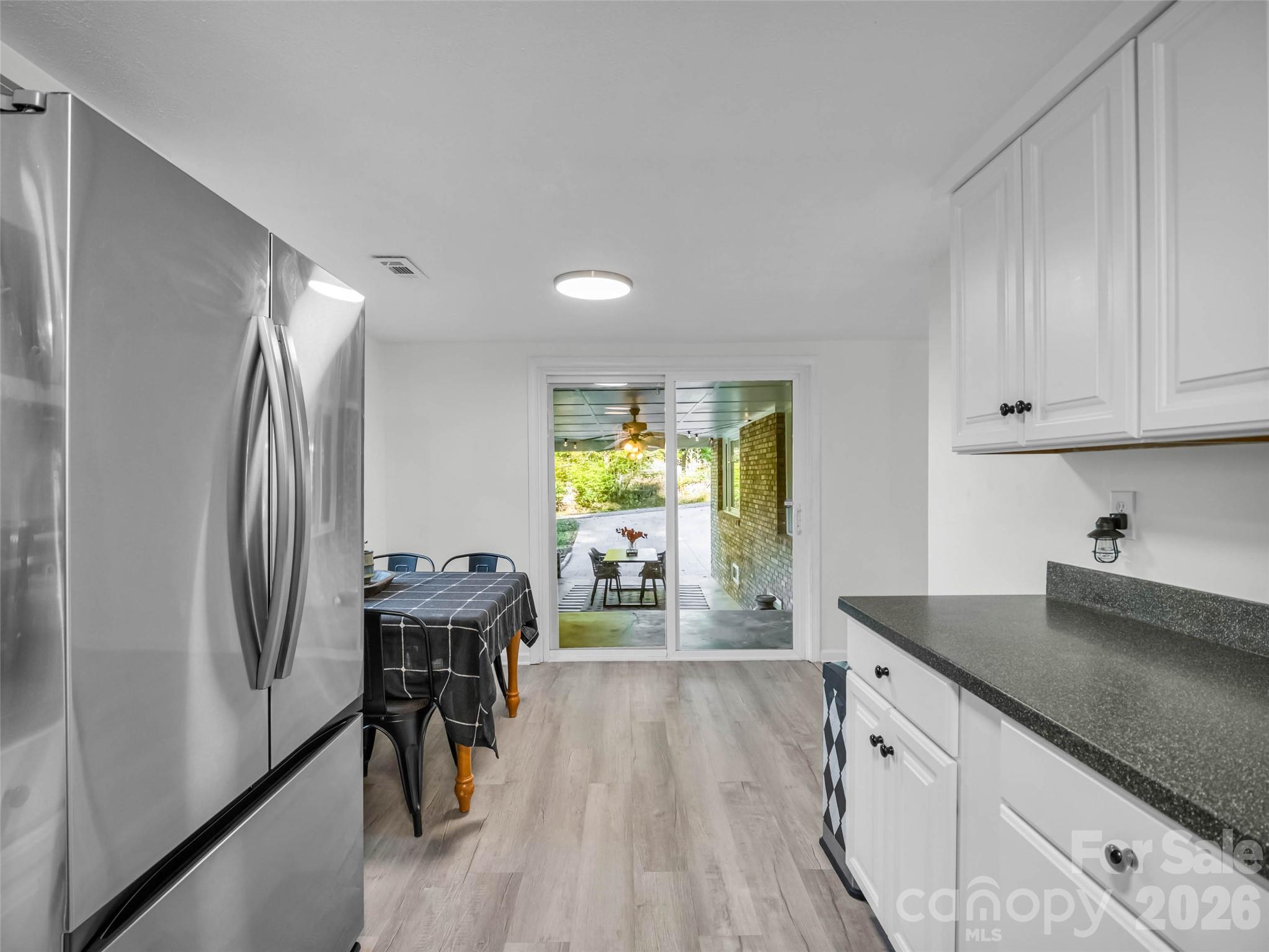 An easy connection between the kitchen and dining space. - 913 Dorothy Street, Hendersonville