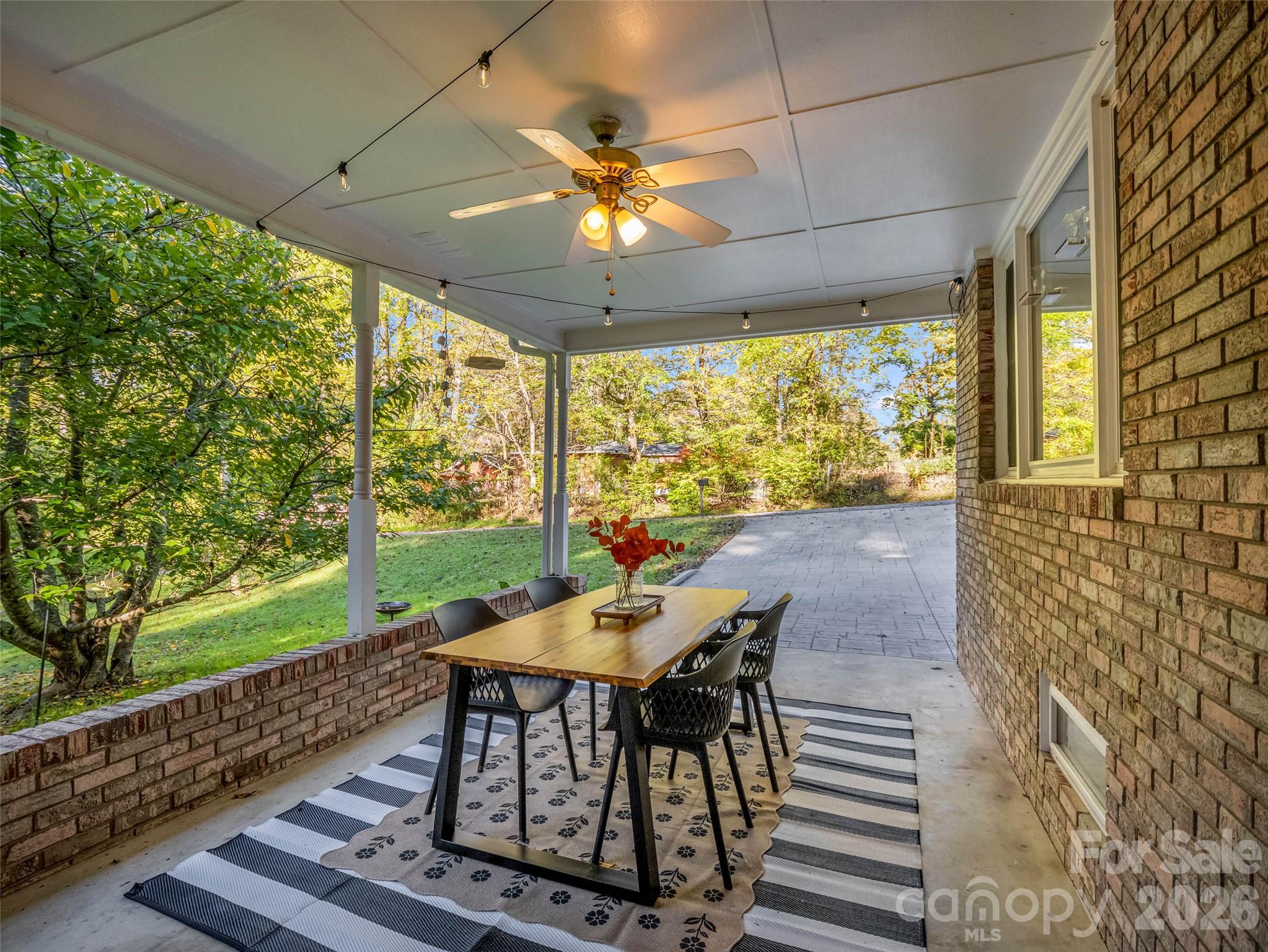 A covered carport area can extend your living space outside. - 913 Dorothy Street, Hendersonville