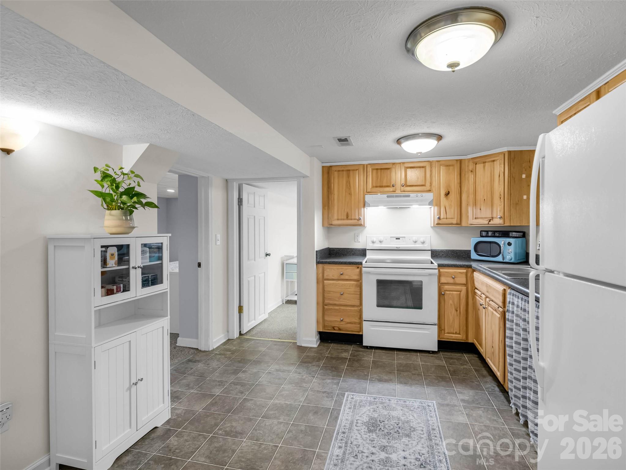 A second kitchen makes independent living arrangements possible. - 913 Dorothy Street, Hendersonville