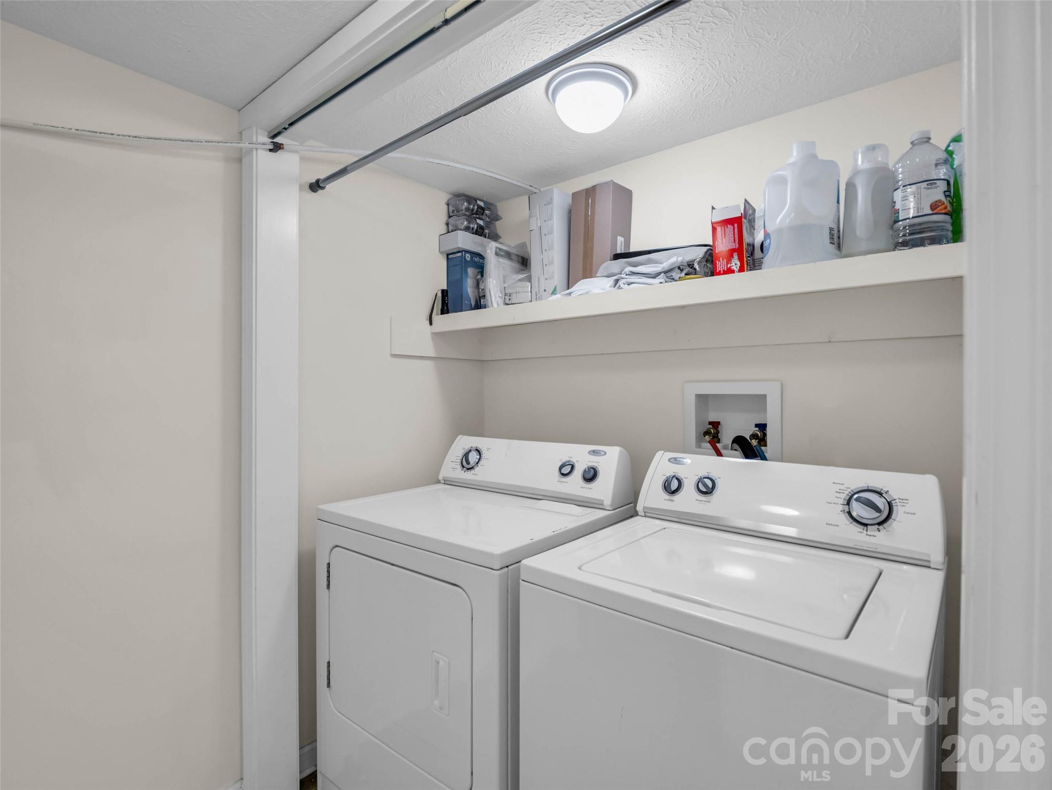 A dedicated downstairs laundry area adds convenience. - 913 Dorothy Street, Hendersonville