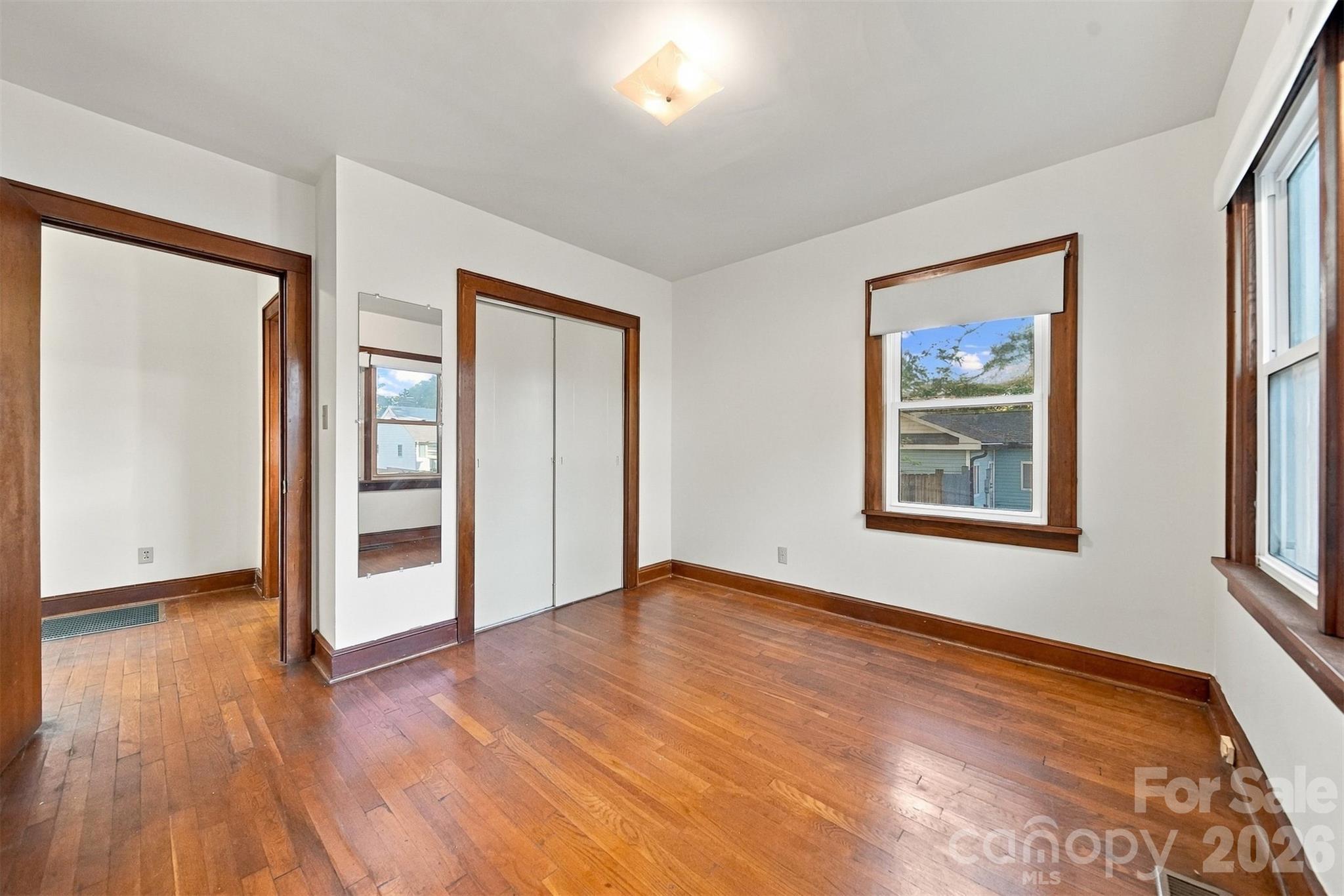 Bedroom #2 at back of the home. Lots of natural light, hardwood floors and big closet. - 203 W 21st Street, Newton
