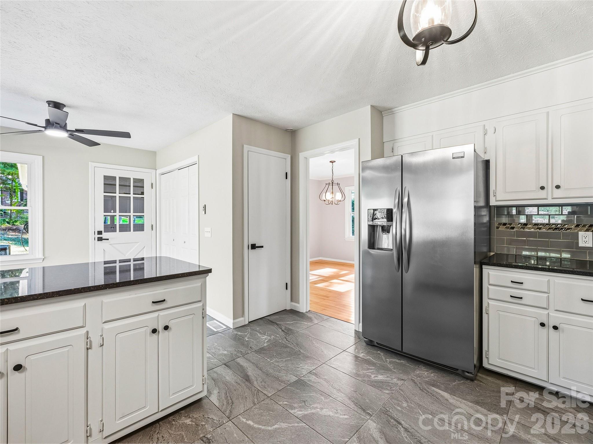 Kitchen has Tile Floors with a Pantry and Storage Closets - 133 Kent Lane, Hendersonville