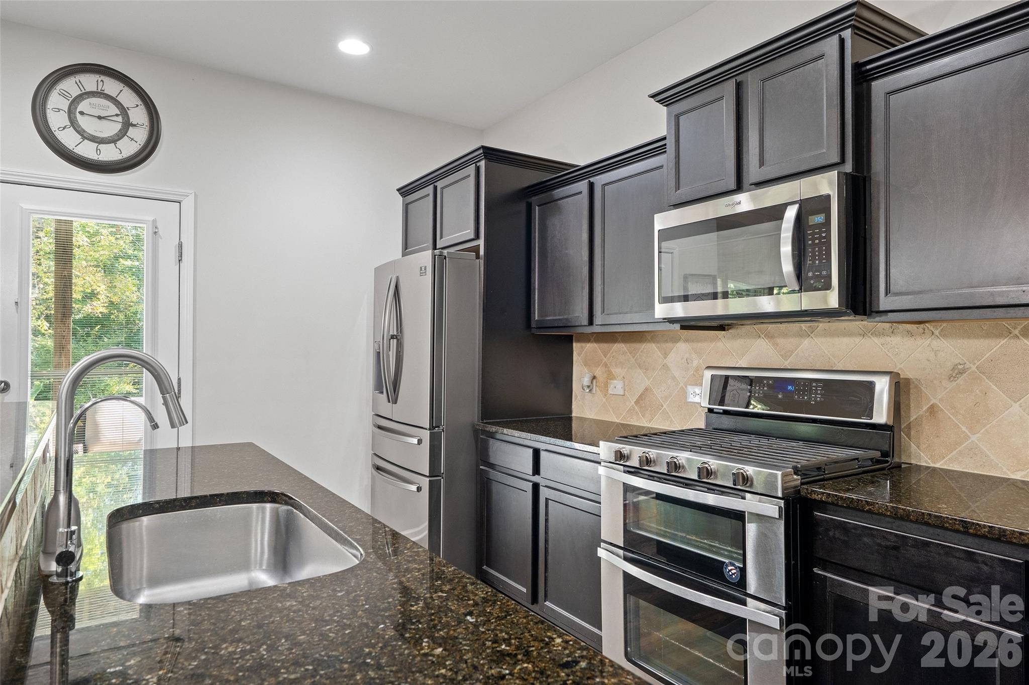 Staggered 30" cabinets and stainless appliances/Basement - 423 Crisfield Court, York