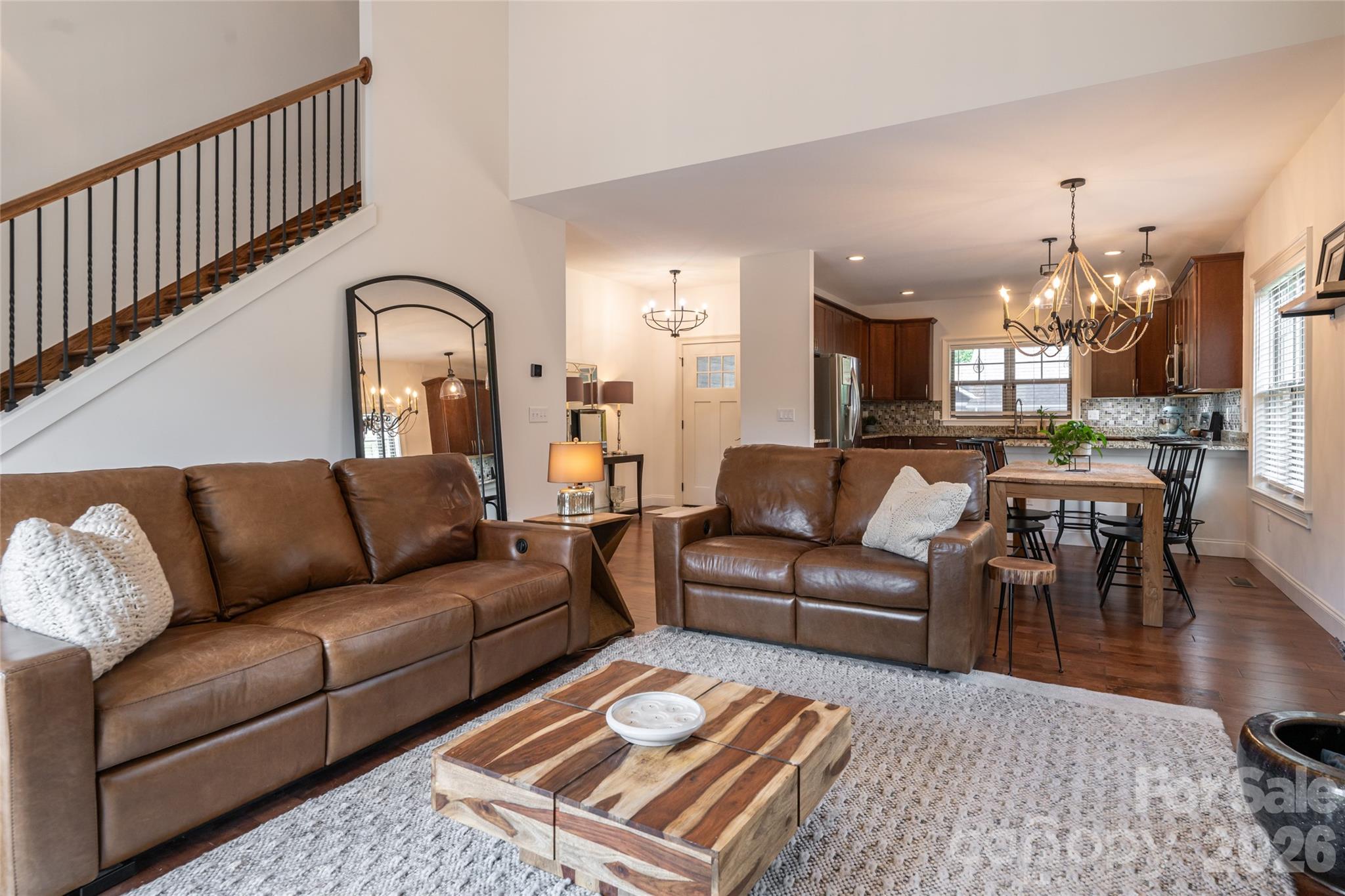 Great room flowing directly into the kitchen — one continuous living space on the main level. - 17 Asher Lane, Arden