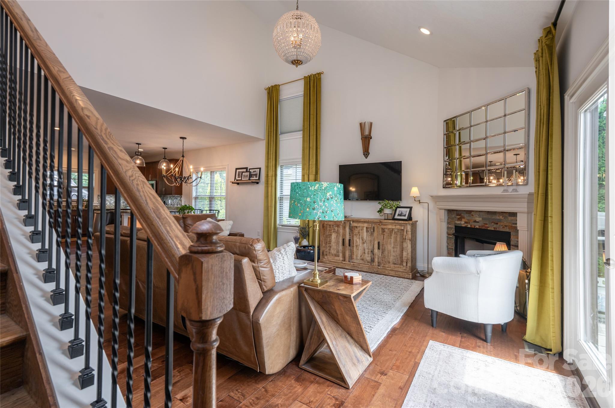 Staircase with balusters rising from the great room to the upper level. - 17 Asher Lane, Arden
