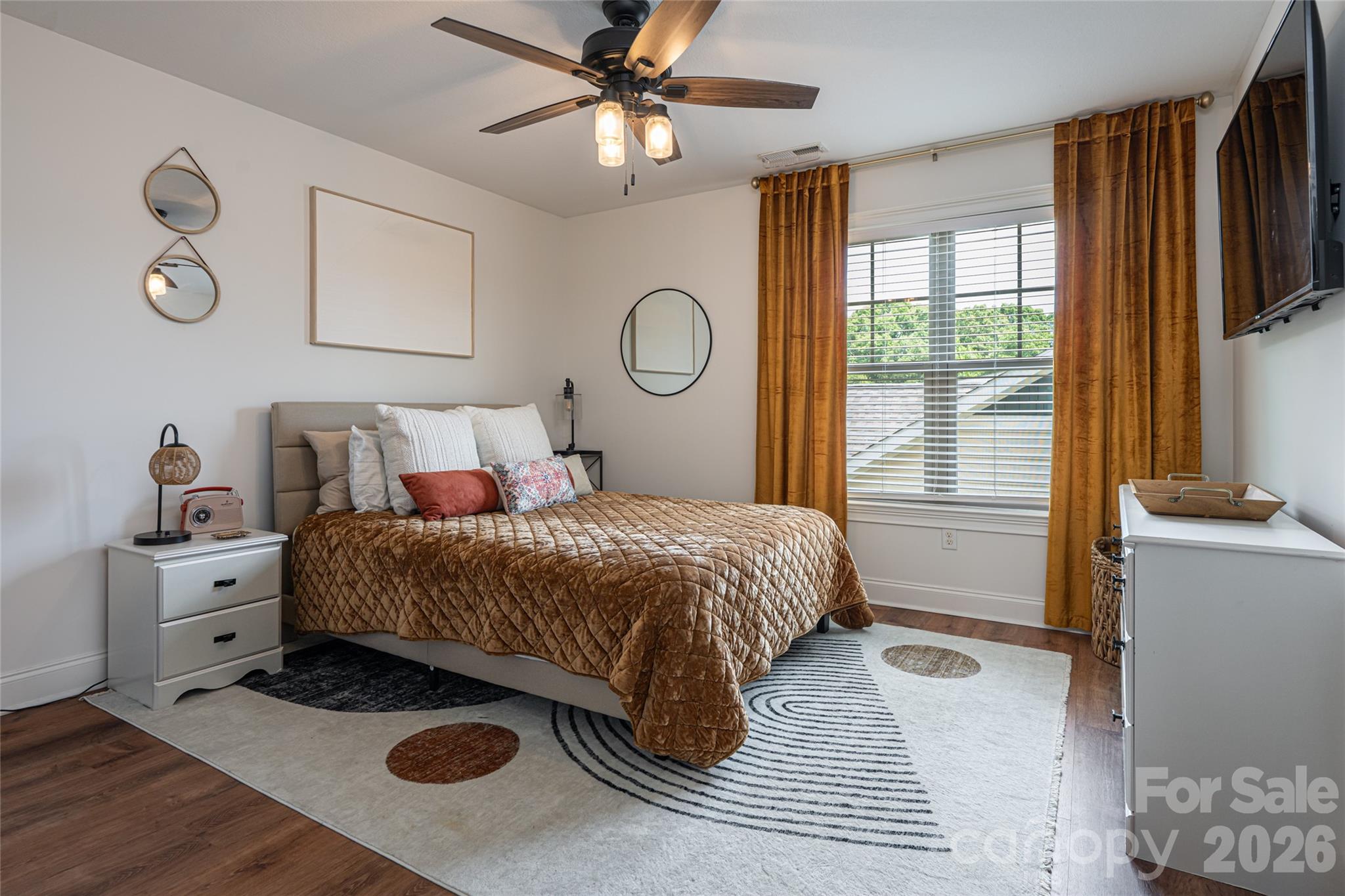 Second upstairs bedroom with ceiling fan and bright corner windows. - 17 Asher Lane, Arden