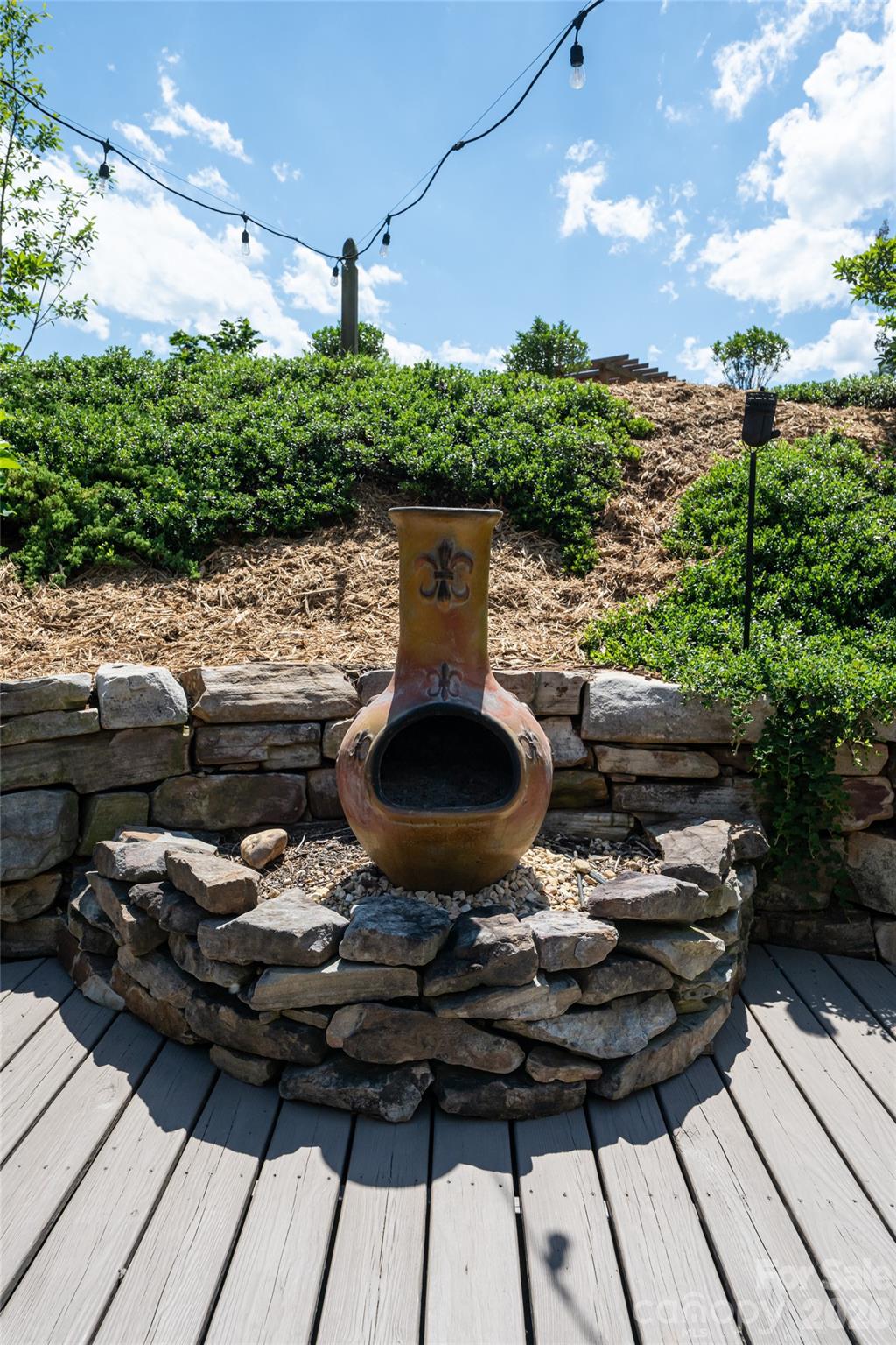 Patio with chiminea fire feature, a defined outdoor gathering spot. - 17 Asher Lane, Arden