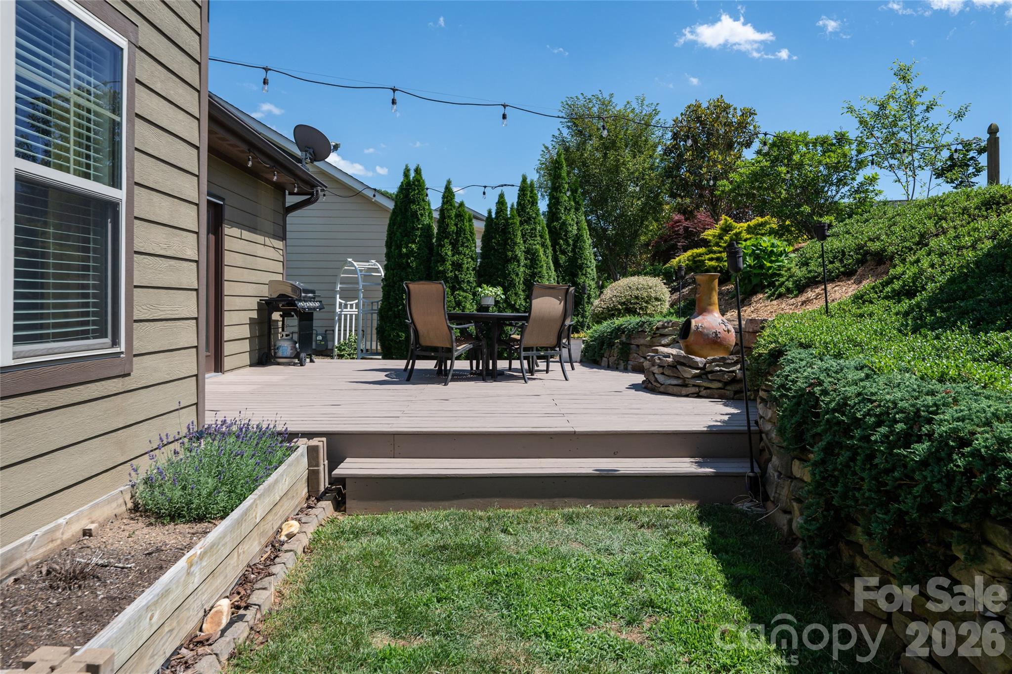 Deck and level lawn area showing the low-maintenance backyard. - 17 Asher Lane, Arden