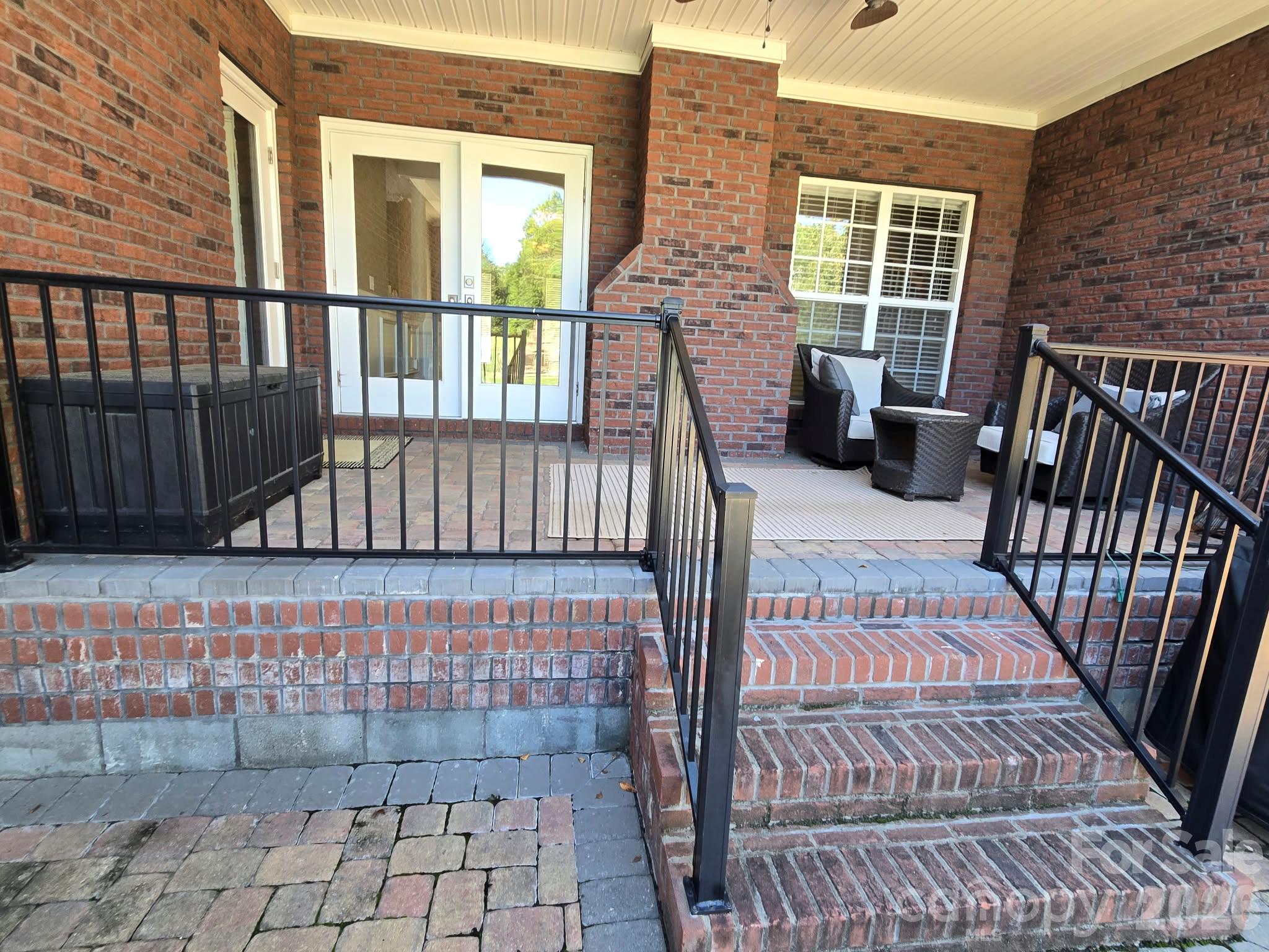 Rear Covered Brick patio overlooking pool - 3008 Scottsdale Lane, Matthews