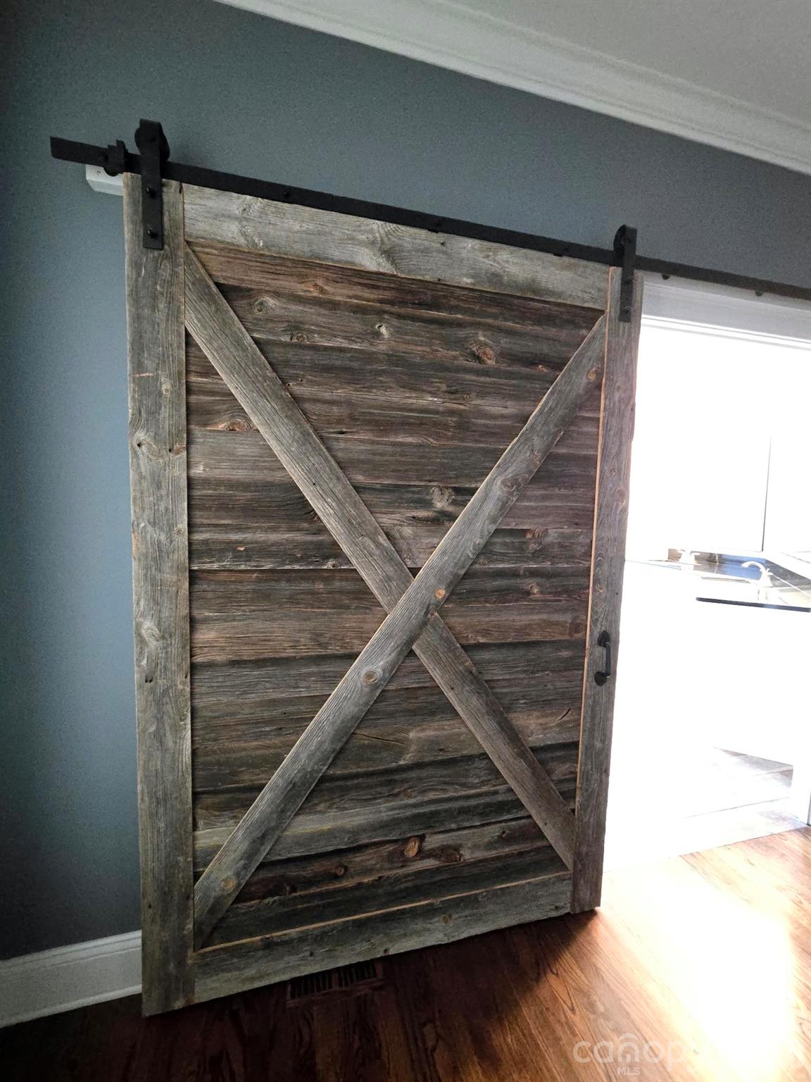 2 real barn wood doors in the main bedroom - 3008 Scottsdale Lane, Matthews
