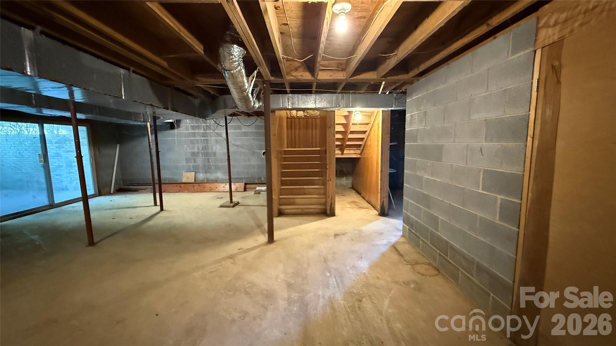 Unfinished Basement with sliding glass doors to patio - 36934 Tercher Road, New London