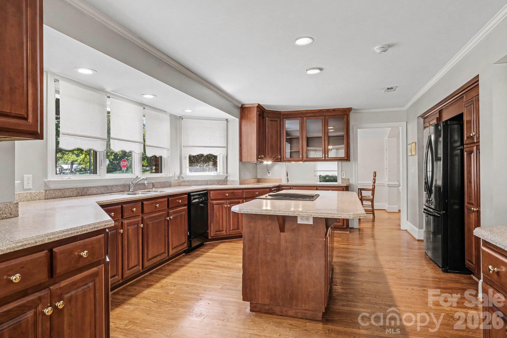 Enjoy appetizers and drinks with guests at the oversized seated island while you're putting the finishing touches on supper - 746 Grandview Drive NE, Concord