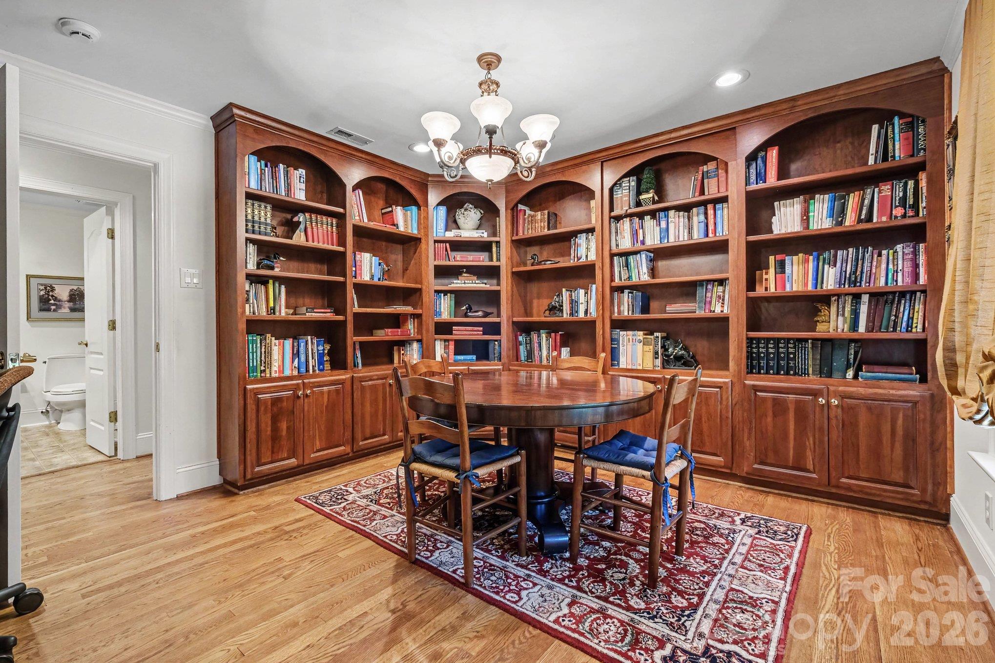 Versatile library with beautiful custom built-ins connects to the executive office - can also function as a nursery, playroom, collectibles showcase, or potential 5th bedroom (just add a wardrobe!) - 746 Grandview Drive NE, Concord
