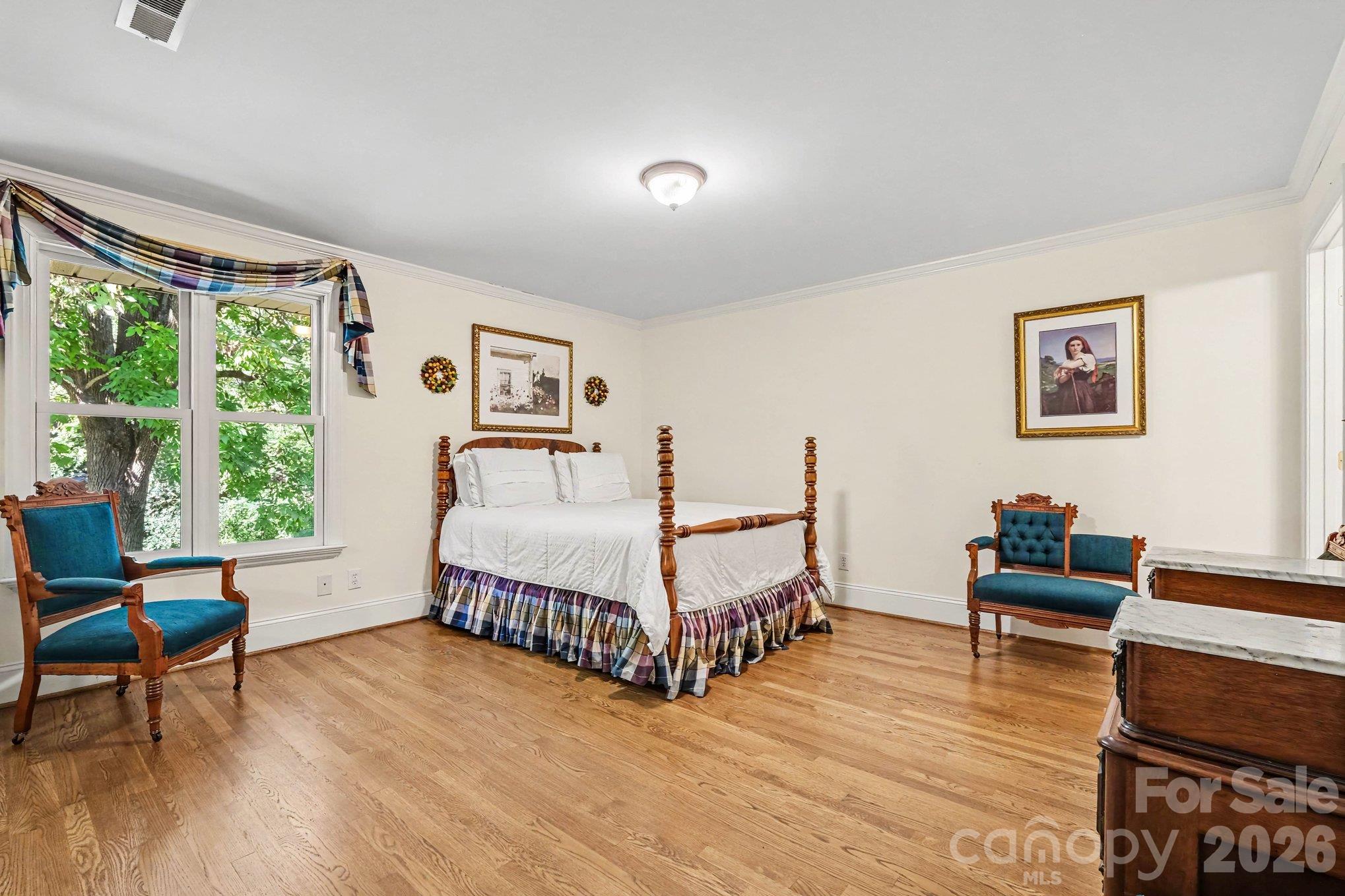 Guest/second primary bedroom with private en-suite on the main level - 746 Grandview Drive NE, Concord
