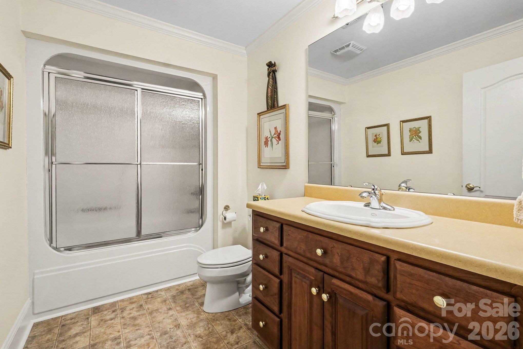 Private en-suite for the main level guest/second primary bedroom - 746 Grandview Drive NE, Concord