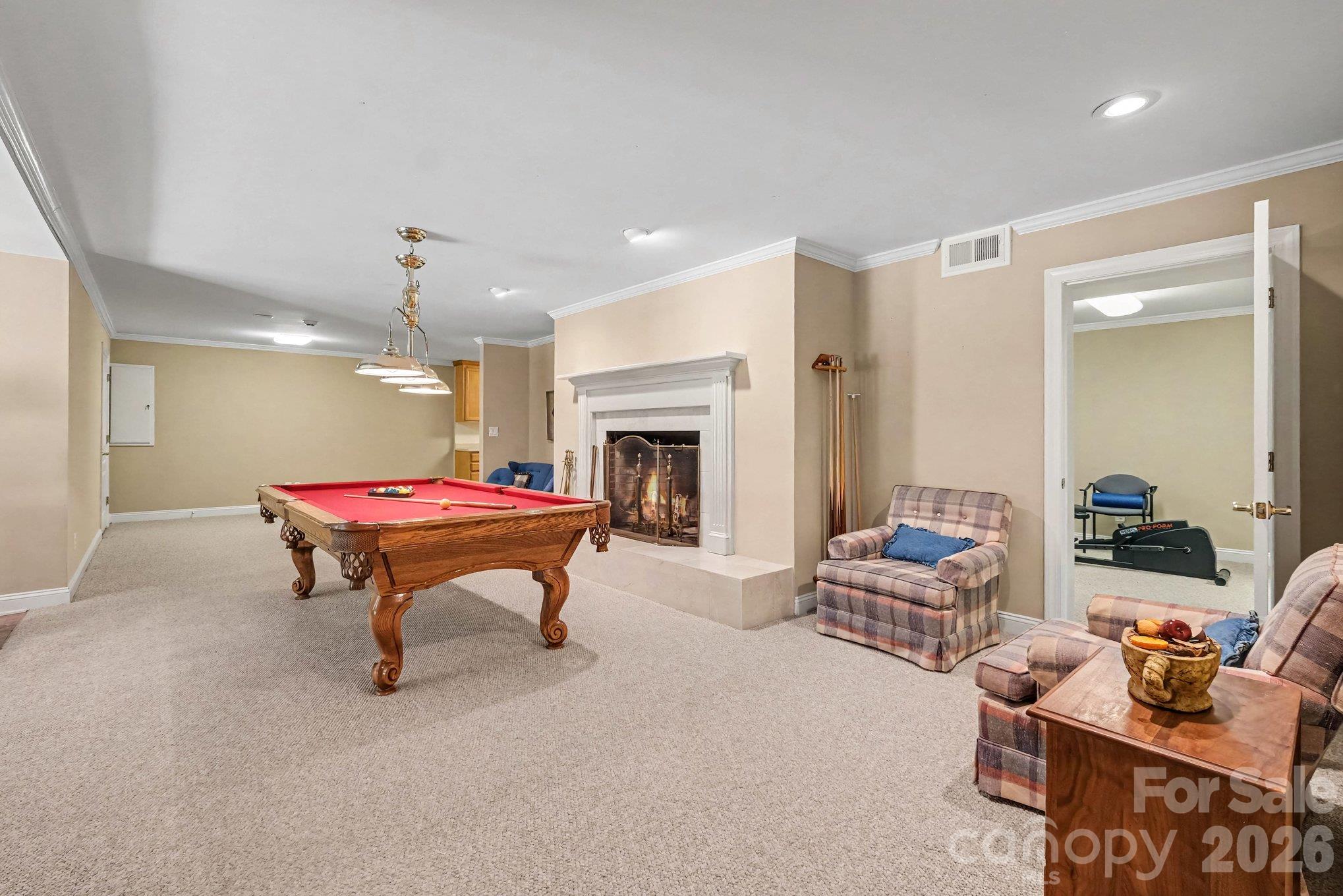 Versatile, living/recreation/dining area with cozy wood burning fireplace - 746 Grandview Drive NE, Concord