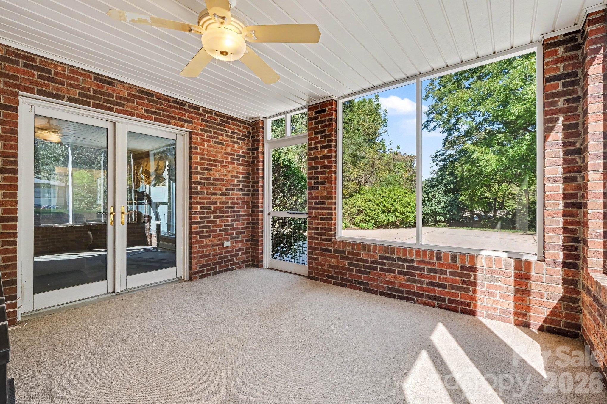 Private screened-in porch directly off of the basement family room and exterior access - 746 Grandview Drive NE, Concord