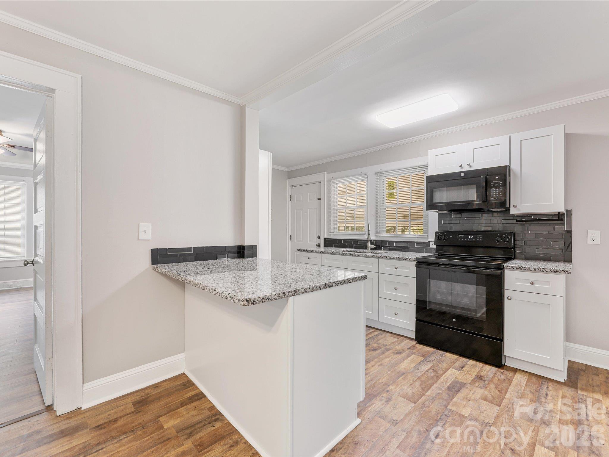 Kitchen peninsula w/ room to add 2 barstools - 721 Broad Street, Kannapolis