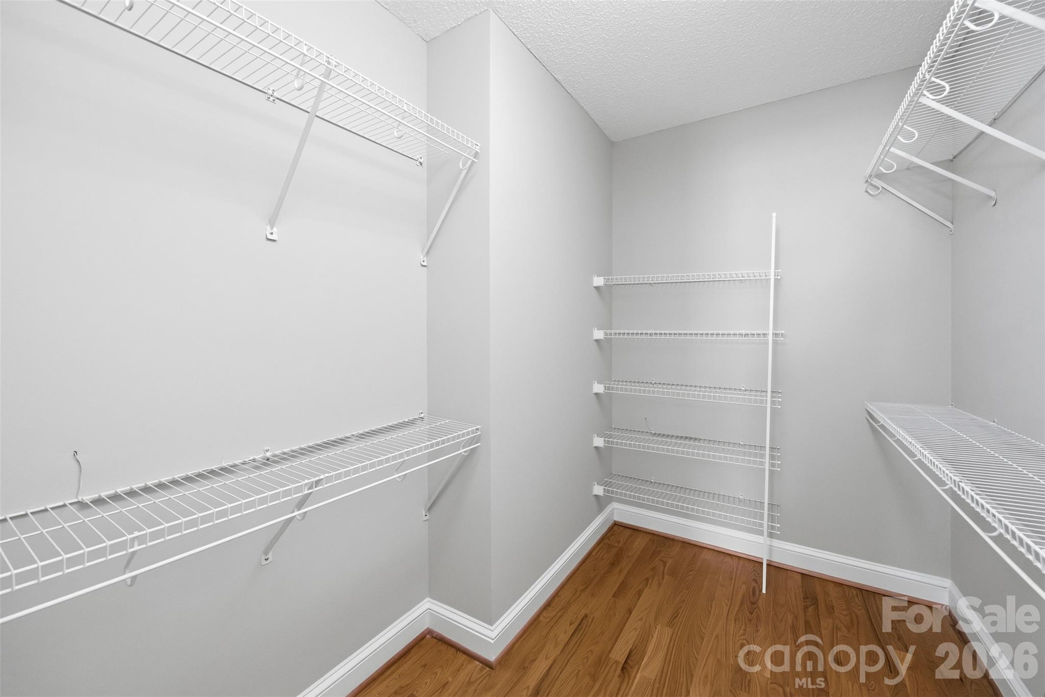 Walk-in closet in primary bedroom - 9014 Pickering Grove Lane, Charlotte