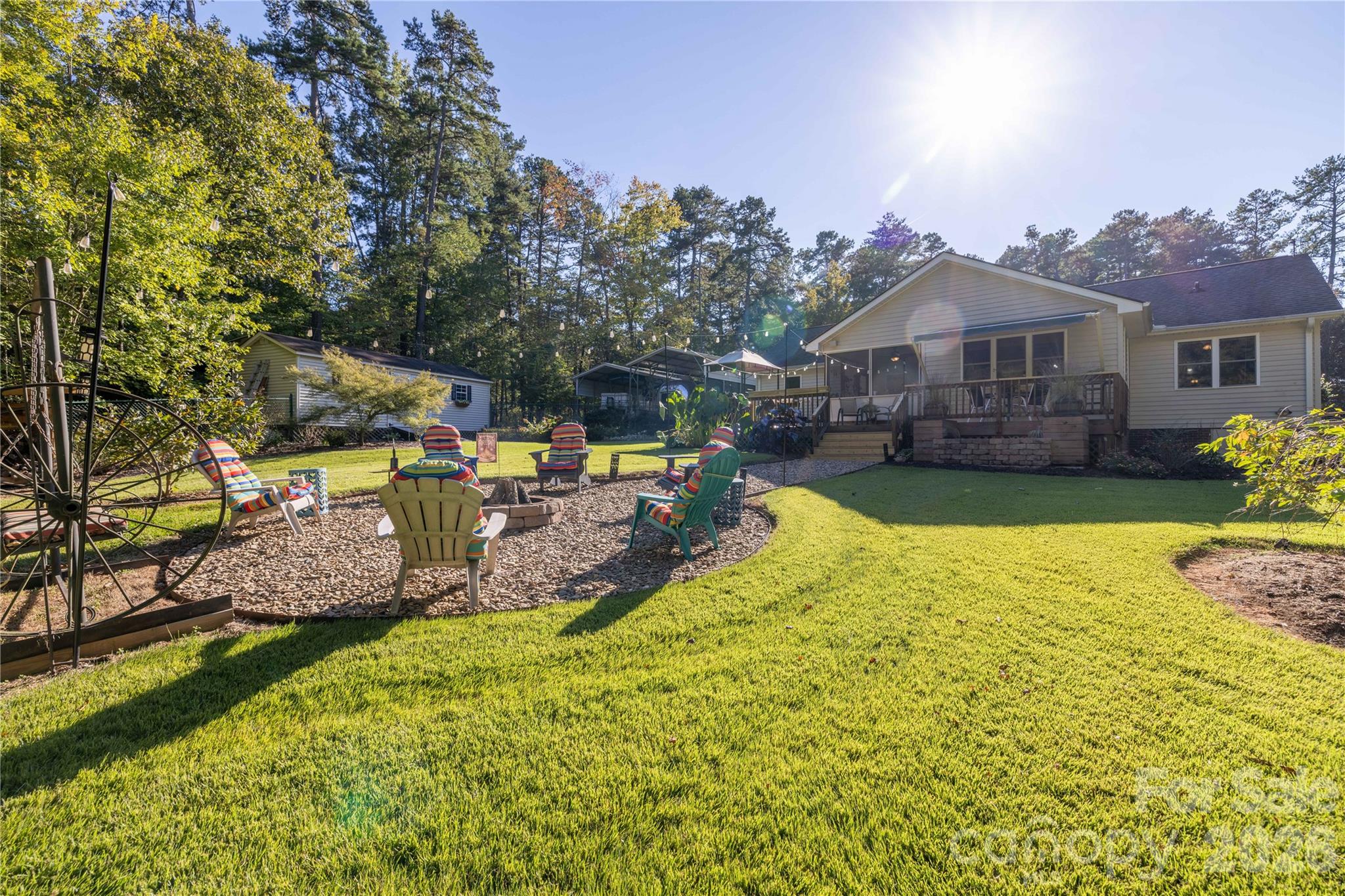 Huge fenced in backyard with firepit and gorgeous plants for all seasons. - 571 Newport Drive, Mount Gilead