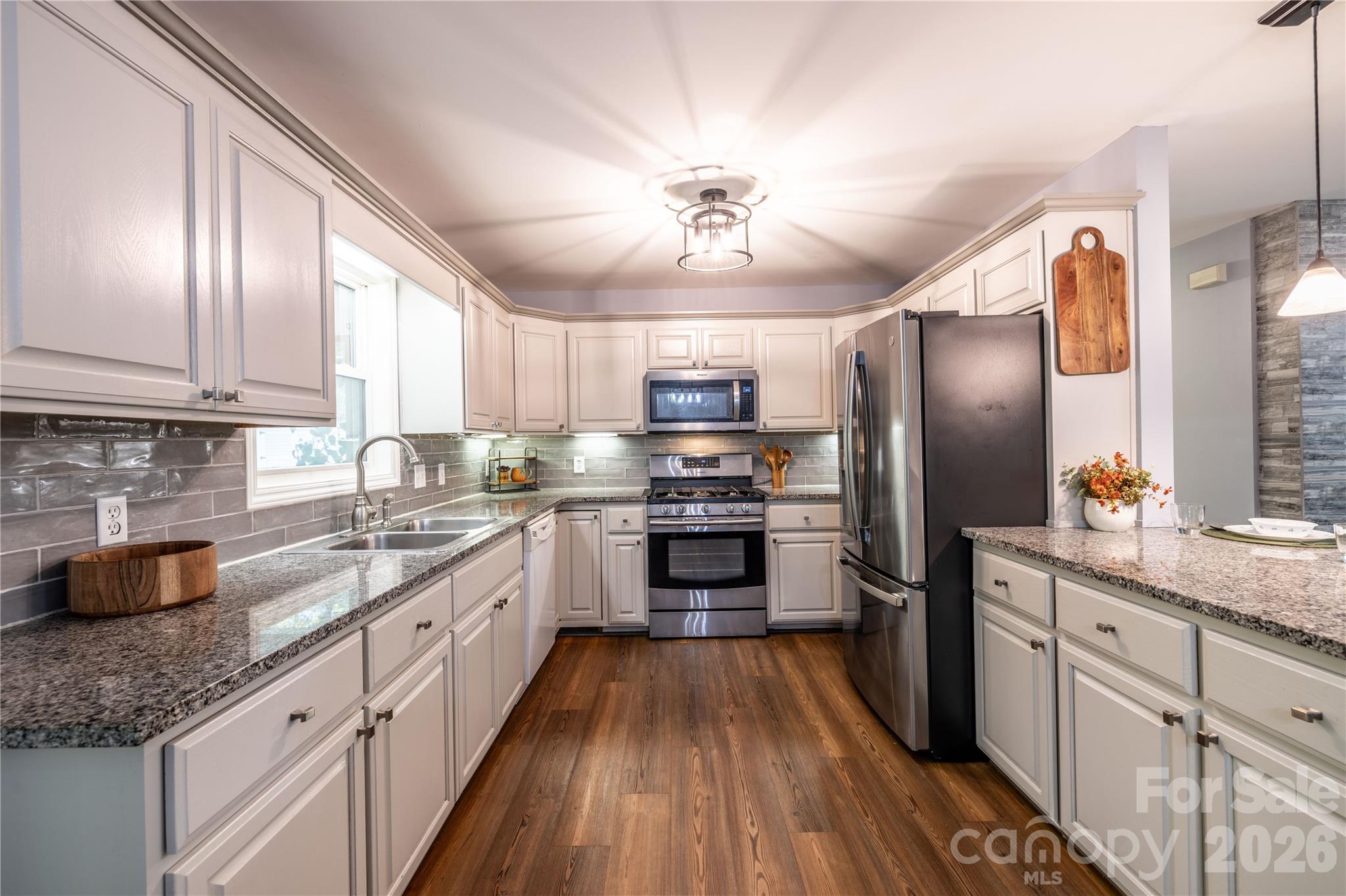 Lovely updated kitchen backsplash and countertopsNew Refrigerator - 571 Newport Drive, Mount Gilead