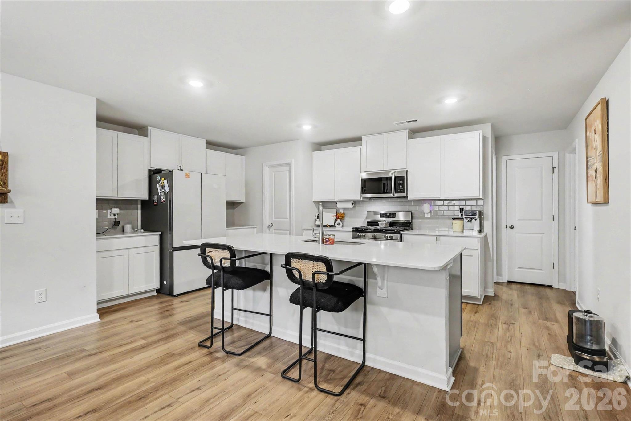 kitchen with bar seating - 149 Catawba Walk Way, Statesville