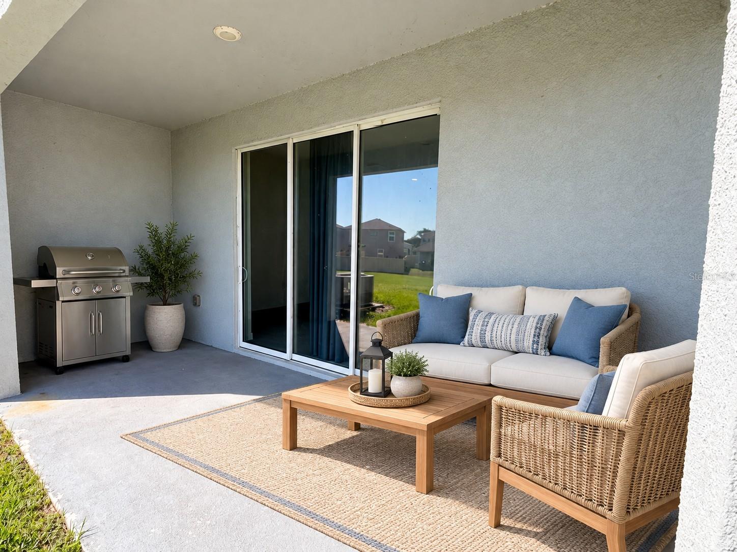 Patio with pond view - 3515 WHITE DANDELION CT, PLANT CITY