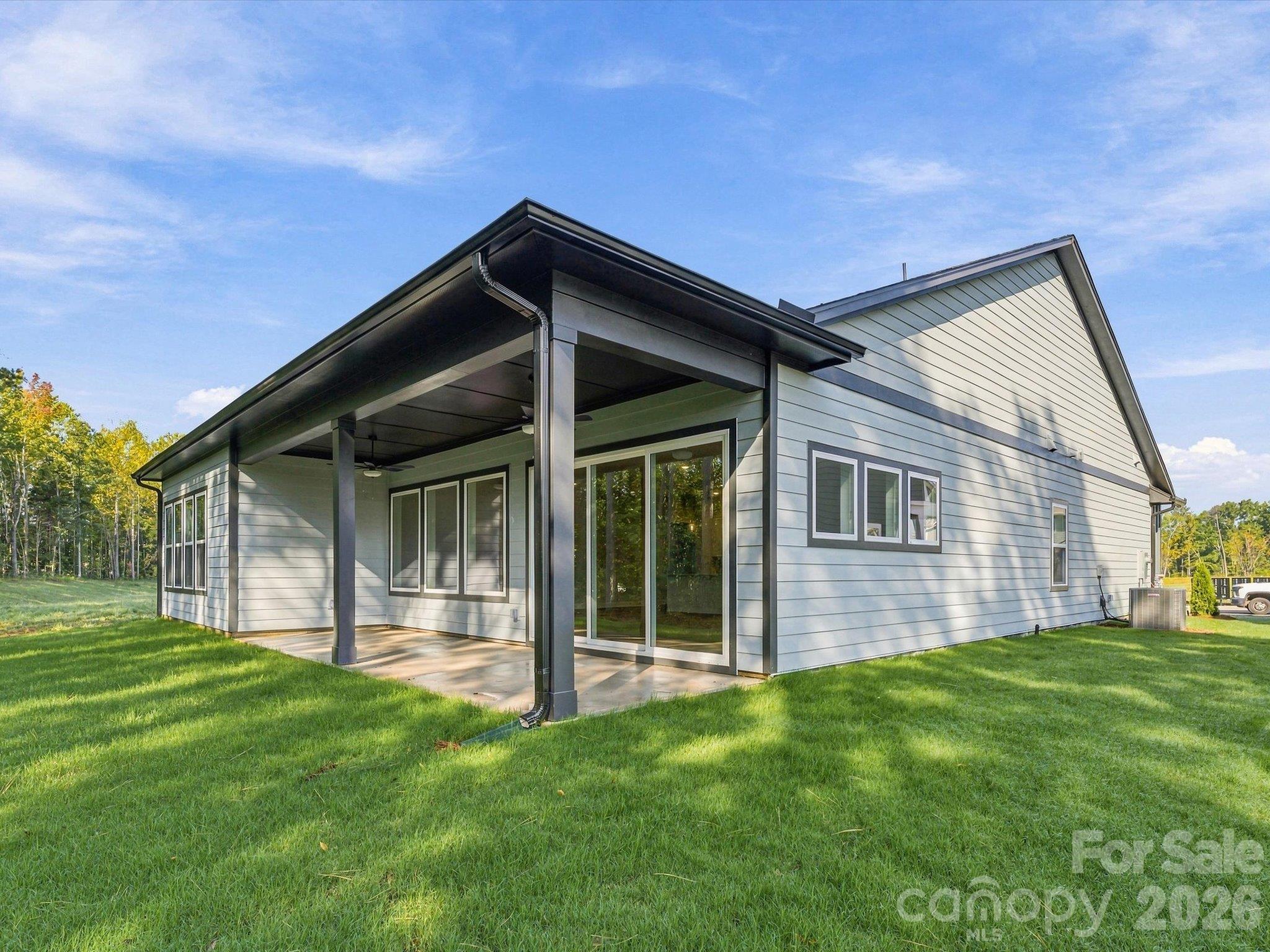 Extended Covered Patio with flat yard space, backs to tree preserve! - 344 Portree Street, Rock Hill