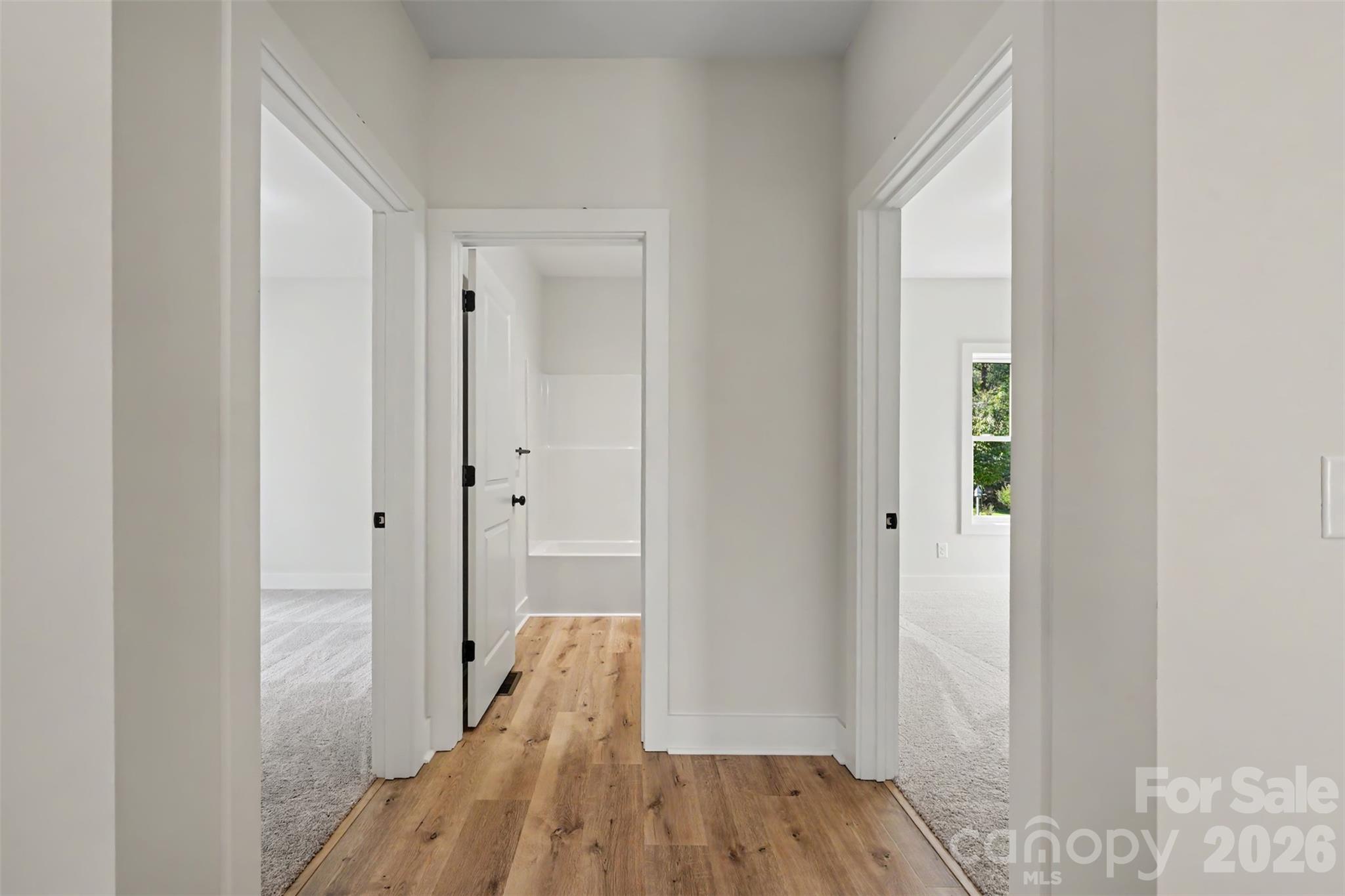 Front bedroom 1 (left), full bathroom 1 (straight), middle bedroom 2 - 910 W 8th Street, Kannapolis
