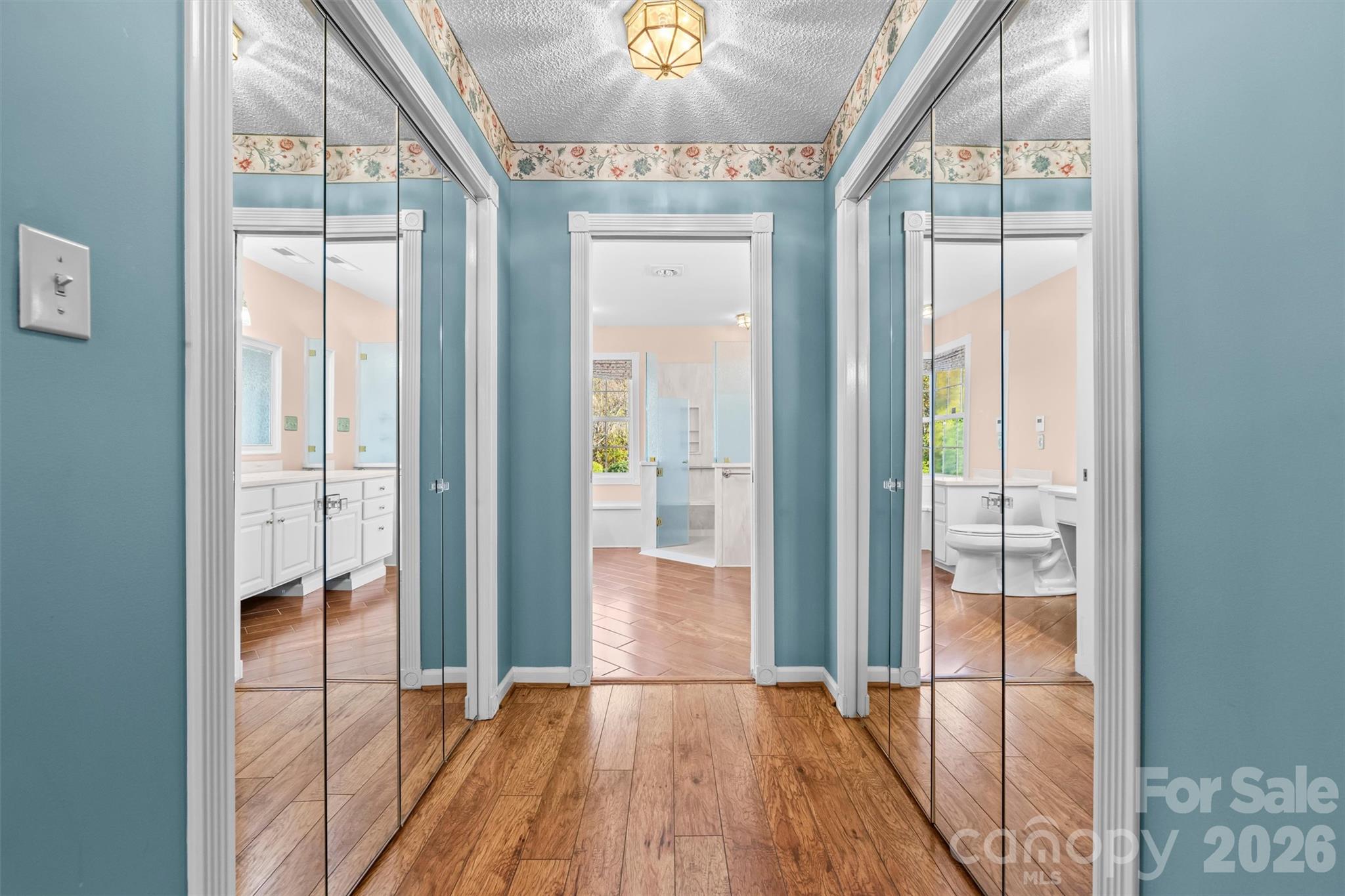 Hallway with closets in Primary Bedroom - 11 Heather Way, Candler