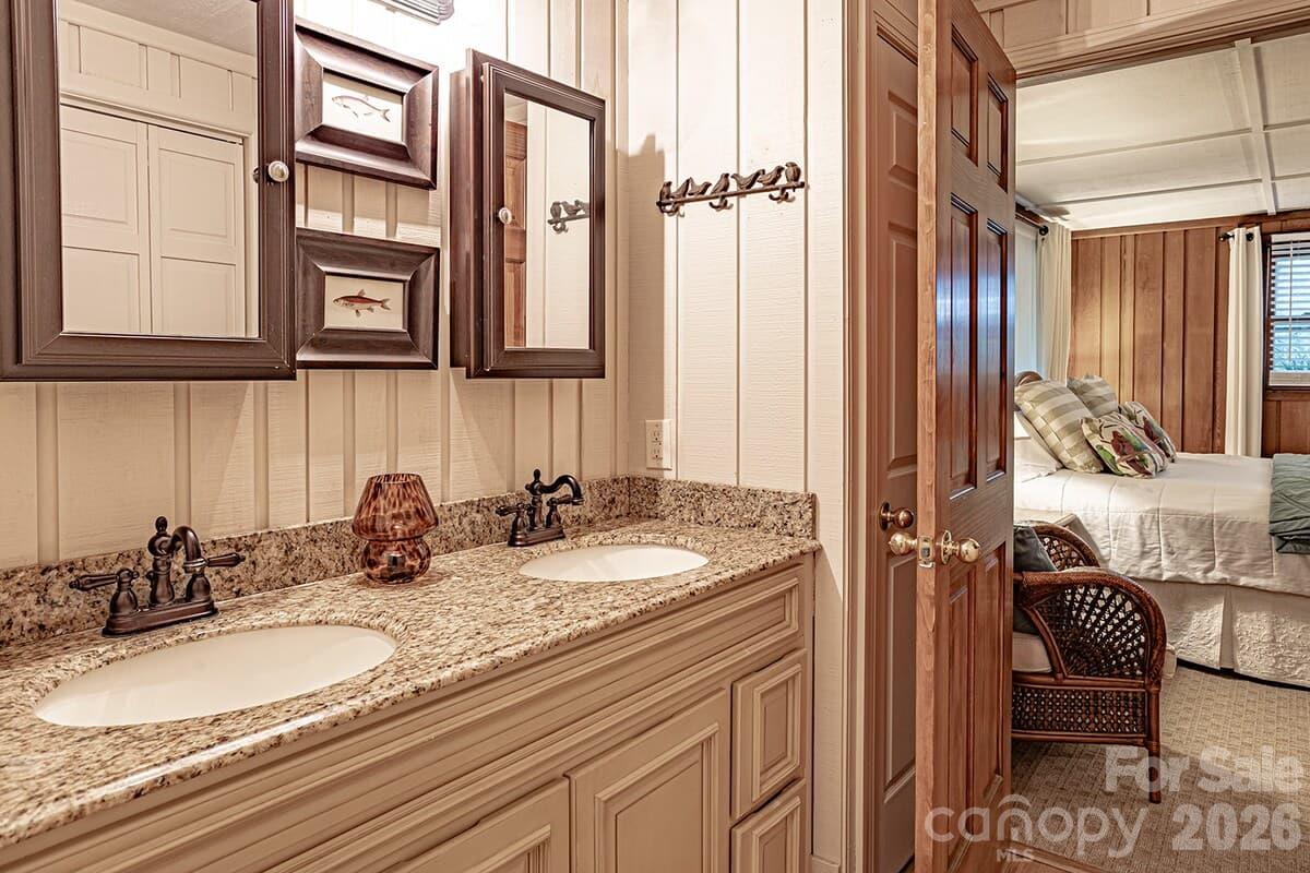 Primary bath on main with access from dining room - 208 N West Lake Drive, Lake Lure