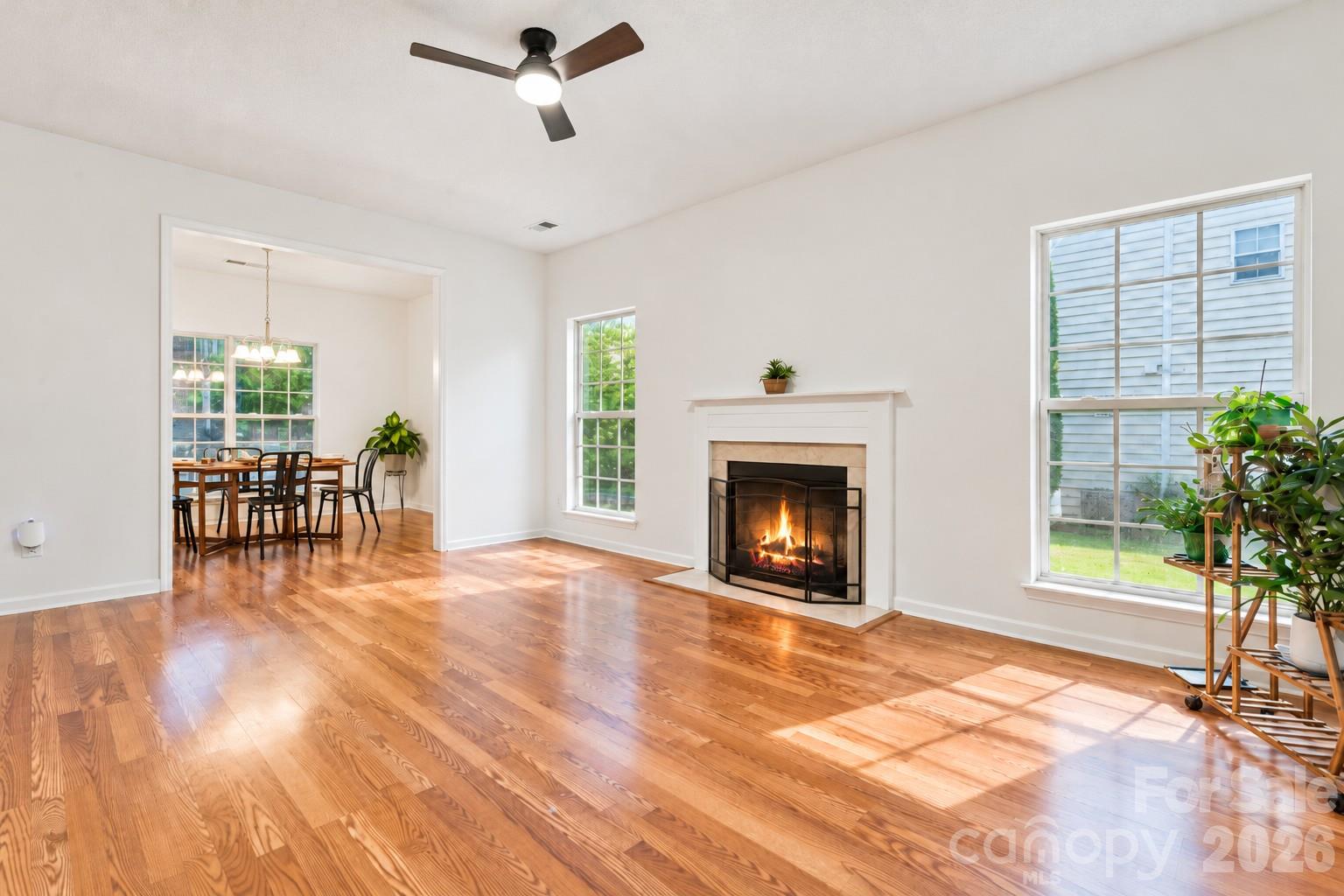 living room with cozy wood burning fireplace - 5645 Winslow Avenue NW, Concord