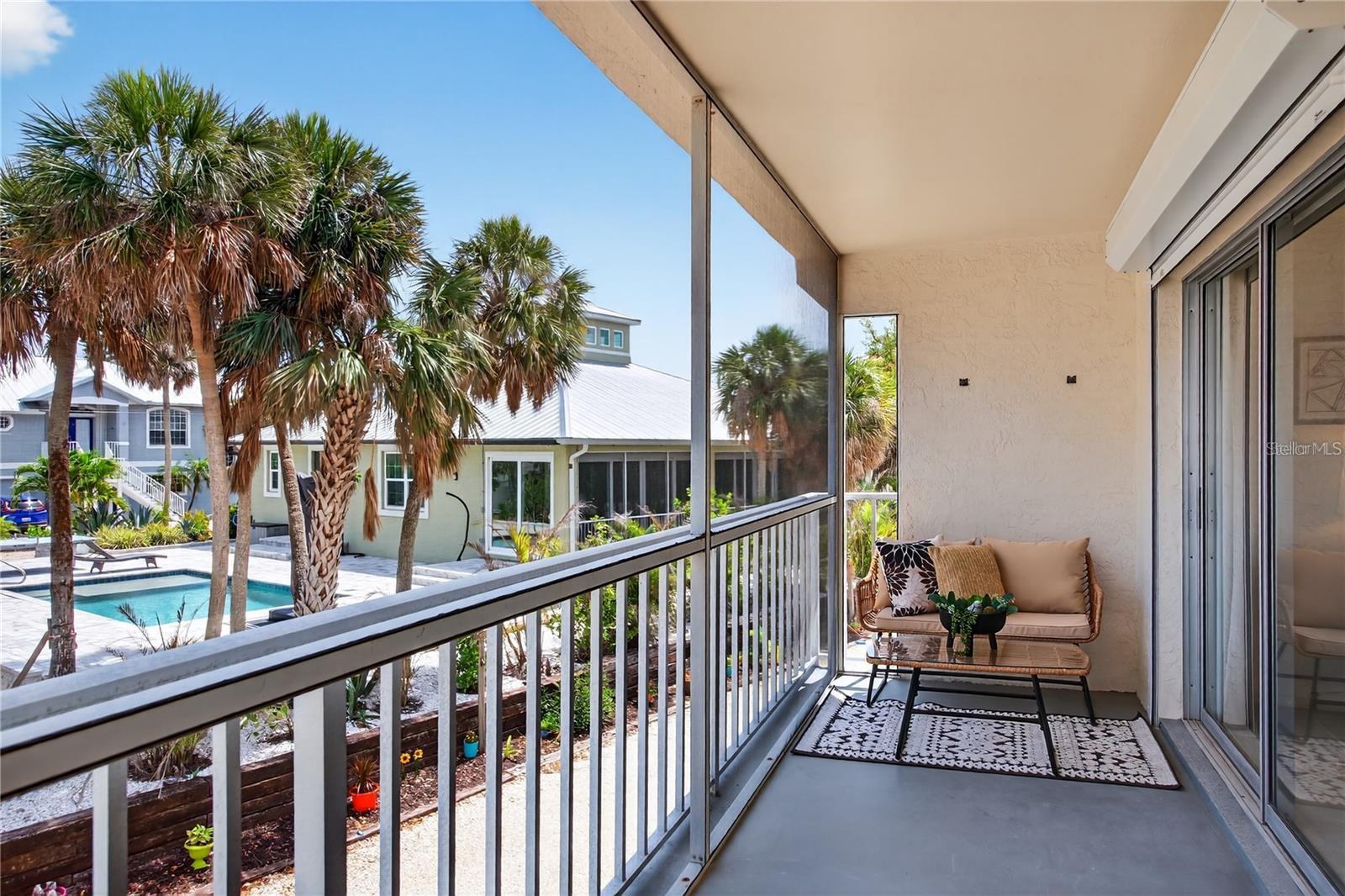 Lanai Directly Off of Living Room and Primary Bedroom with Peekaboo Views to Lemon Bay - 5031 N BEACH RD #118, ENGLEWOOD