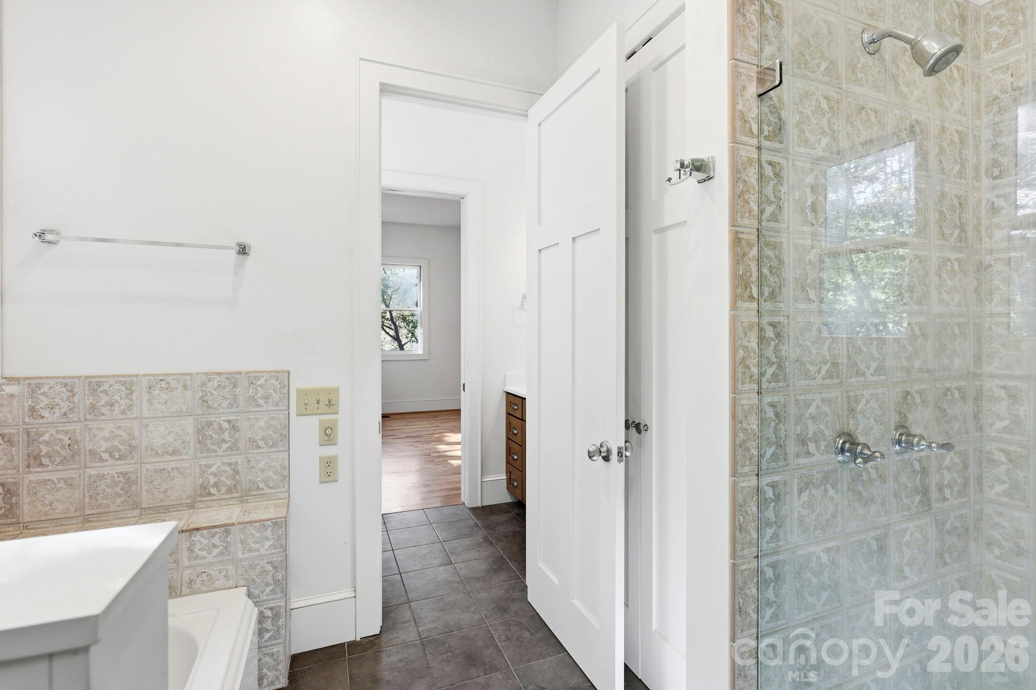 Primary Bath with walk in shower, tub, and double vanities - 39 Williams Cove Road, Black Mountain